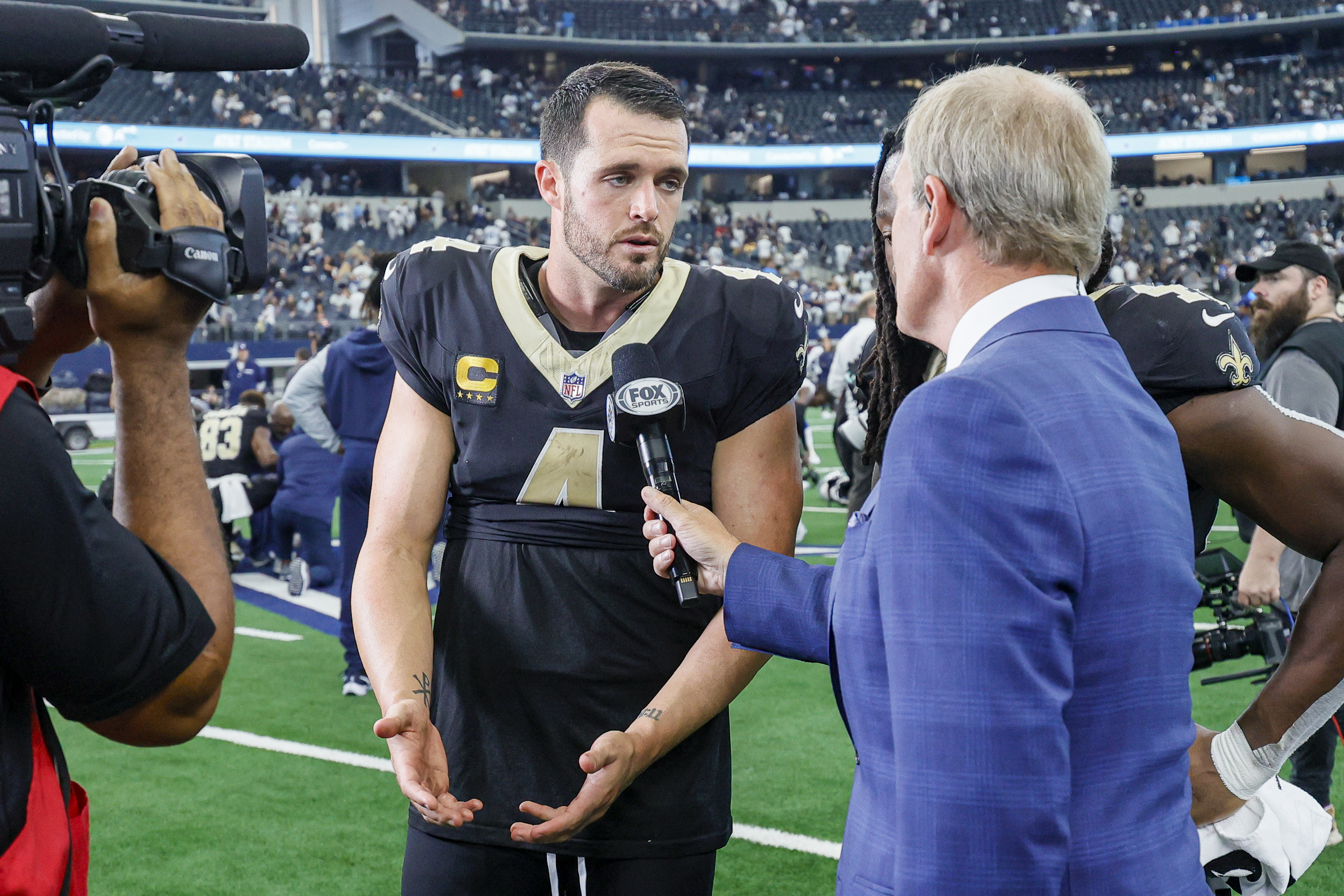 New Orleans Saints quarterback Derek Carr (4) does an interview with FOX Sports Tom Rinaldi after the game between the Dallas Cowboys and the New Orleans Saints.