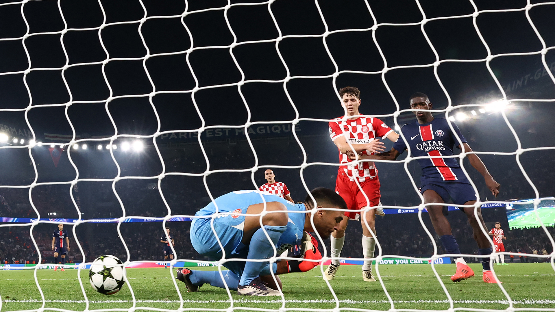 Girona's Argentine goalkeeper #13 Paulo Gazzaniga (C) concedes Paris Saint-Germain's first goal during the UEFA Champions League 1st round day 1 football match between Paris Saint-Germain (PSG) and Girona FC at the Parc des Princes Stadium, in Paris, on September 18, 2024.