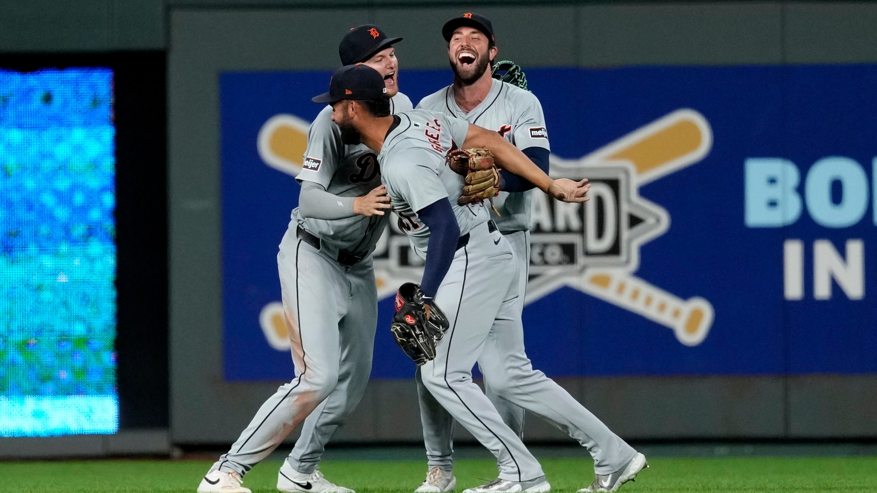 Riley Greene #31, Parker Meadows #22 and Matt Vierling #8 of the Detroit Tigers celebrate a 7-6 win over the Kansas City Royals at Kauffman Stadium on September 16, 2024 in Kansas City, Missouri.