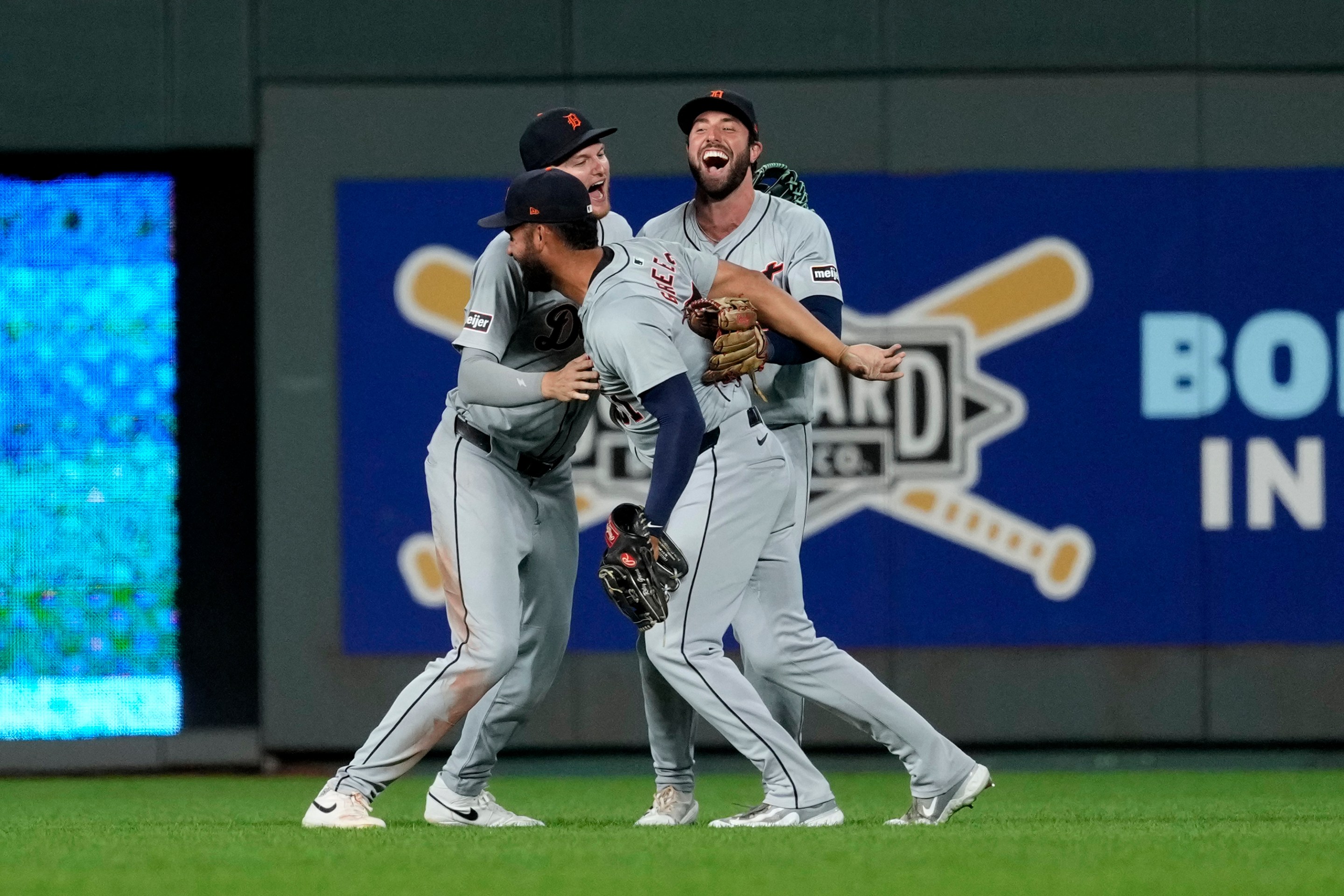 Riley Greene #31, Parker Meadows #22 and Matt Vierling #8 of the Detroit Tigers celebrate a 7-6 win over the Kansas City Royals at Kauffman Stadium on September 16, 2024 in Kansas City, Missouri.