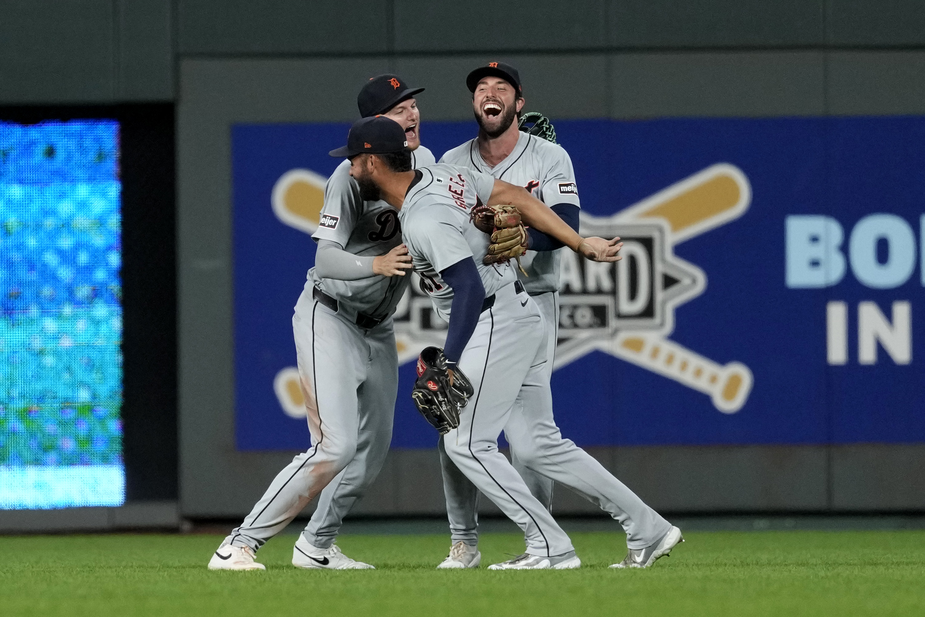Riley Greene #31, Parker Meadows #22 and Matt Vierling #8 of the Detroit Tigers celebrate a 7-6 win over the Kansas City Royals at Kauffman Stadium on September 16, 2024 in Kansas City, Missouri.