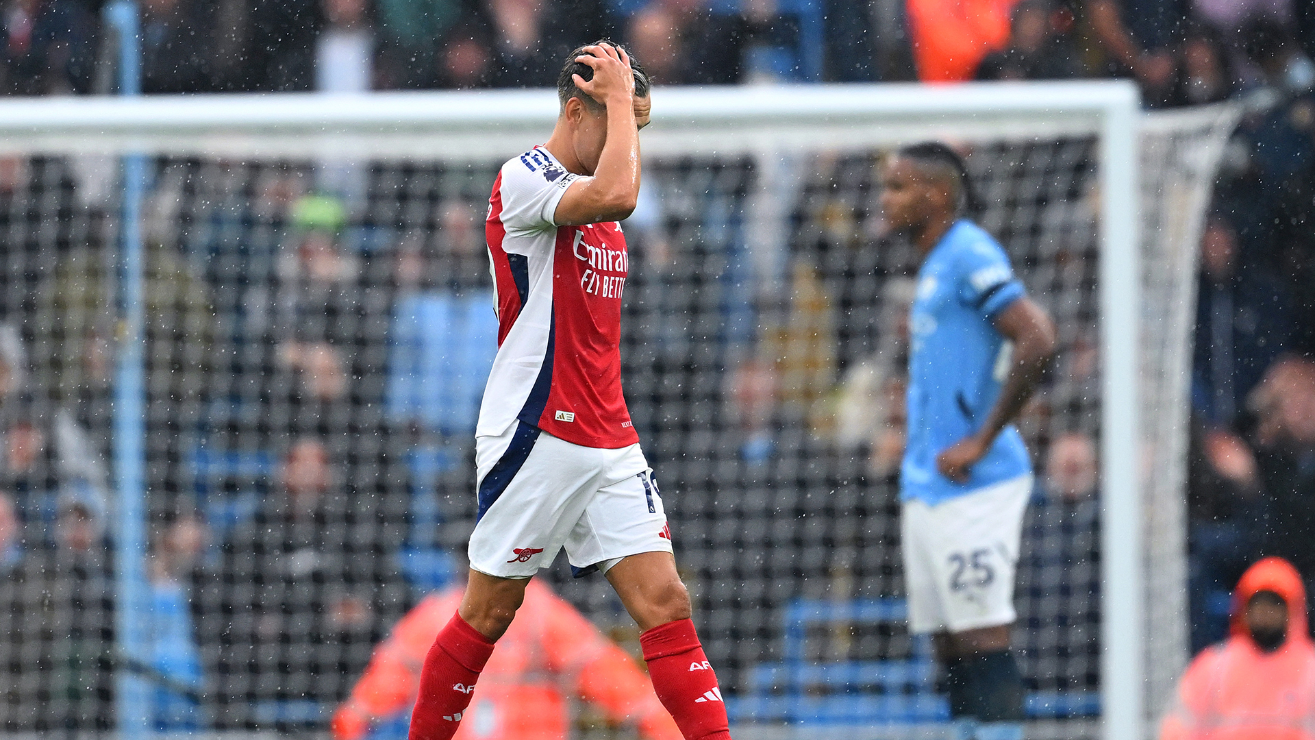 Leandro Trossard of Arsenal leaves the pitch after being shown a red card during the Premier League match between Manchester City FC and Arsenal FC at Etihad Stadium on September 22, 2024 in Manchester, England.