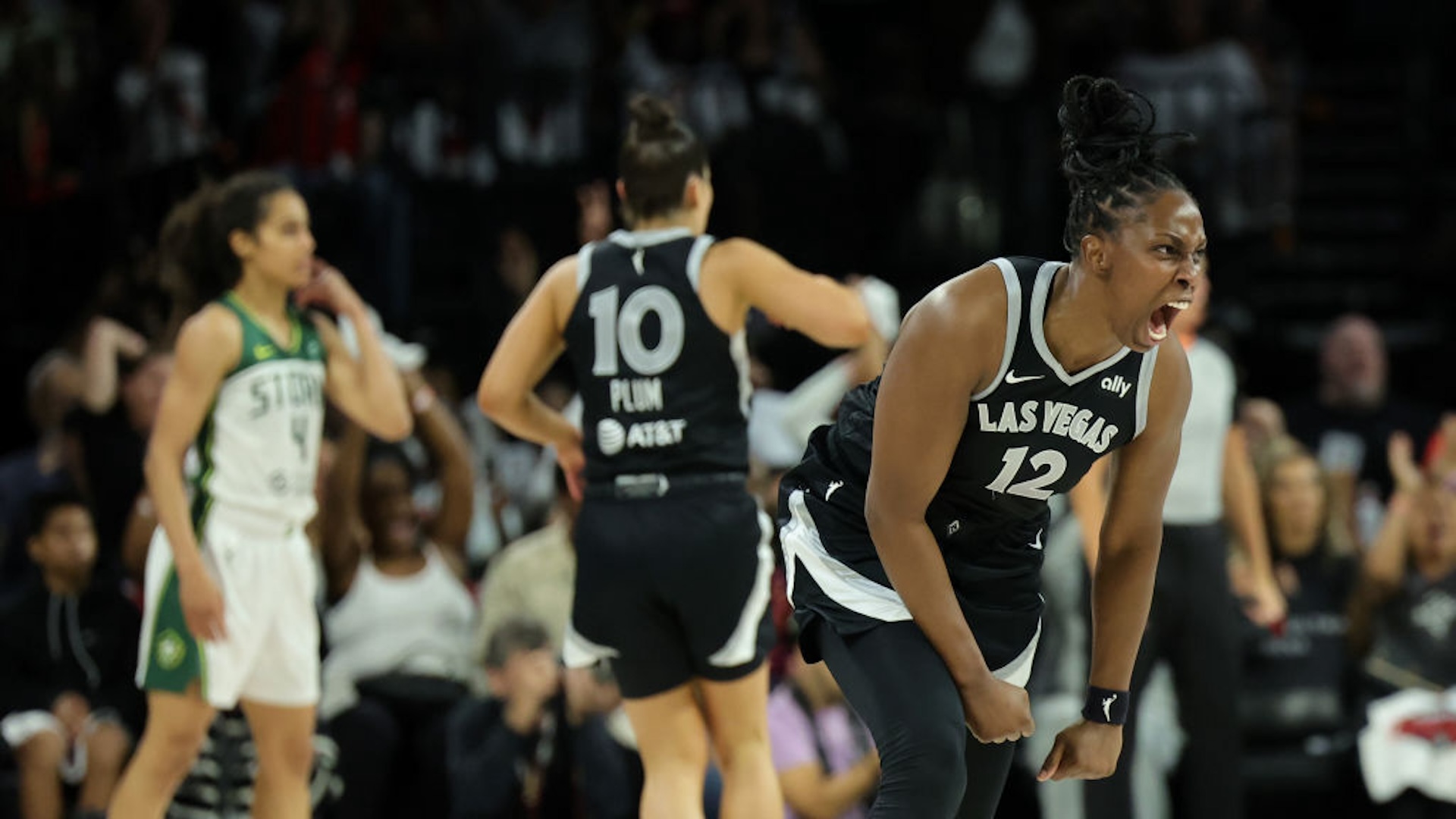 Chelsea Gray #12 of the Las Vegas Aces reacts after assisting Alysha Clark #7 of the Aces on a basket against the Seattle Storm in the second quarter of Game One of the 2024 WNBA Playoffs first round at Michelob ULTRA Arena on September 22, 2024 in Las Vegas, Nevada. NOTE TO USER: User expressly acknowledges and agrees that, by downloading and or using this photograph, User is consenting to the terms and conditions of the Getty Images License Agreement.