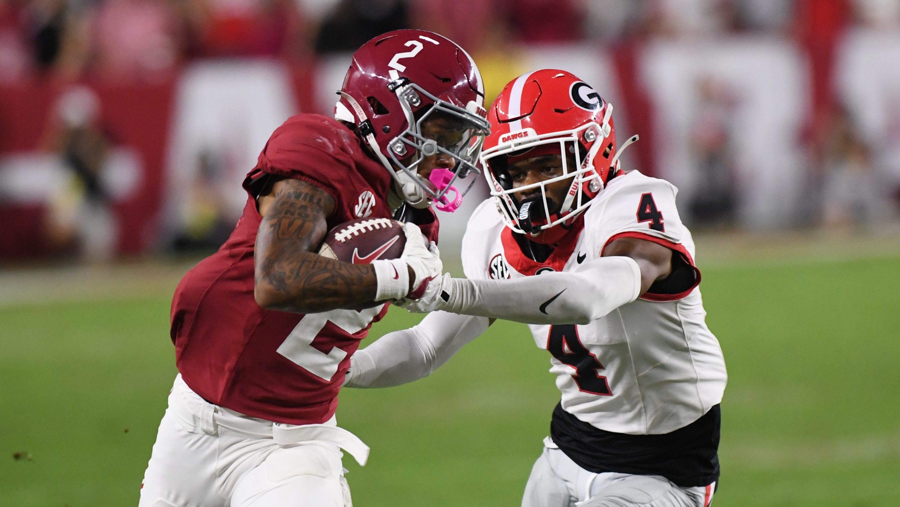 Alabama Crimson Tide wide receiver Ryan Williams (2) rushes the ball as Georgia Bulldogs defensive back KJ Bolden (4) defends during the college football game between the Georgia Bulldogs and the Alabama Crimson Tide on September 28, 2024, at Bryant-Denny Stadium in Tuscaloosa, AL.