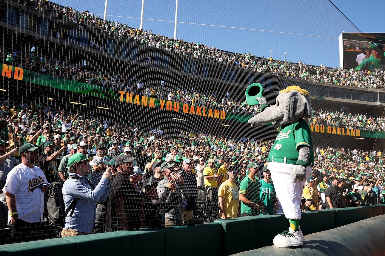 OAKLAND, CALIFORNIA - SEPTEMBER 26: The Oakland Athletics mascot, Stomper, waves to the crowd after the Oakland Athletics beat the Texas Rangers at the Oakland Coliseum on September 26, 2024 in Oakland, California. Today will be the final Athletics game played at the Coliseum. (Photo by Ezra Shaw/Getty Images)