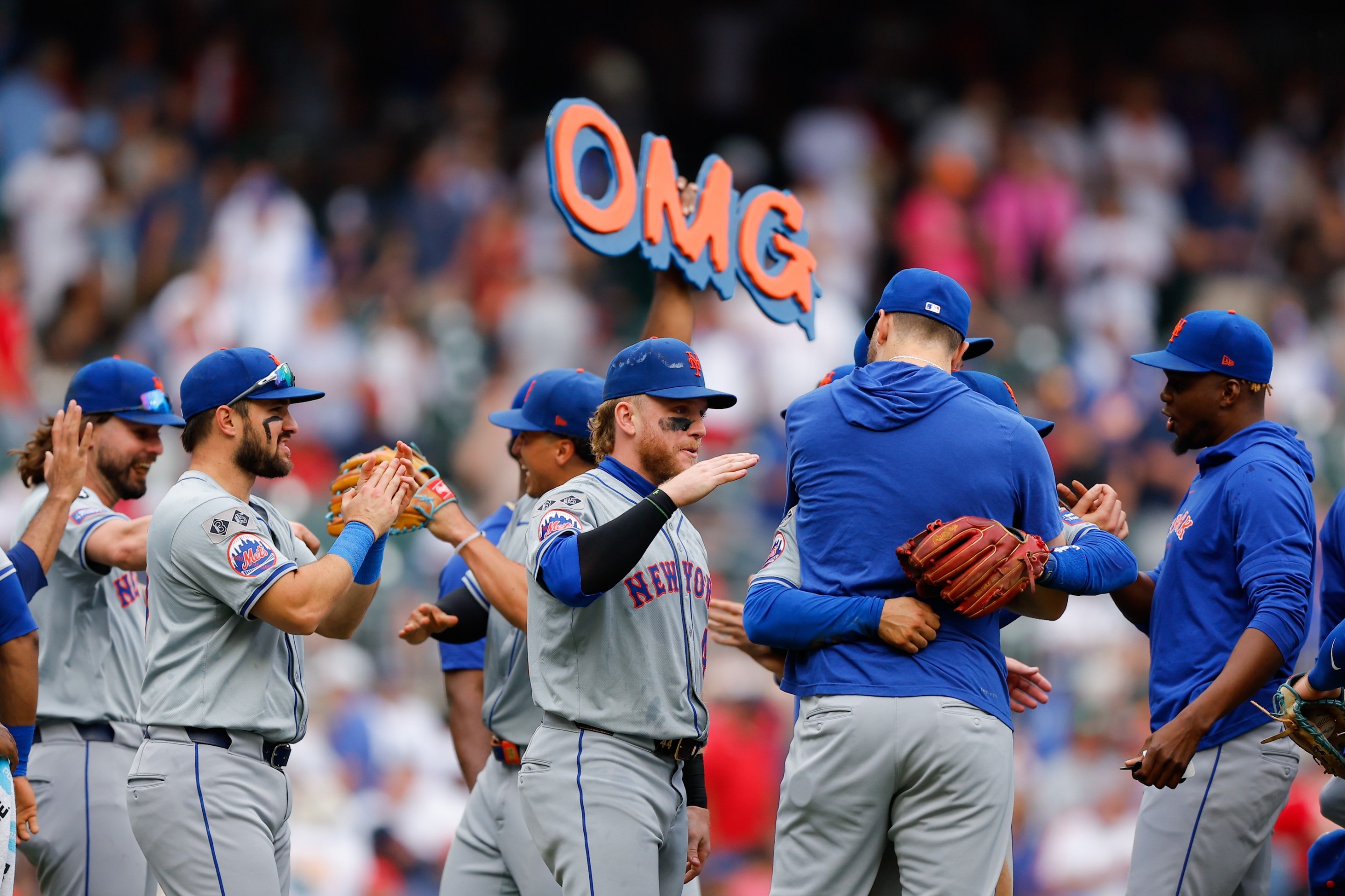 Members of the New York Mets celebrate after defeating the Atlanta Braves at Truist Park on Monday, September 30, 2024.