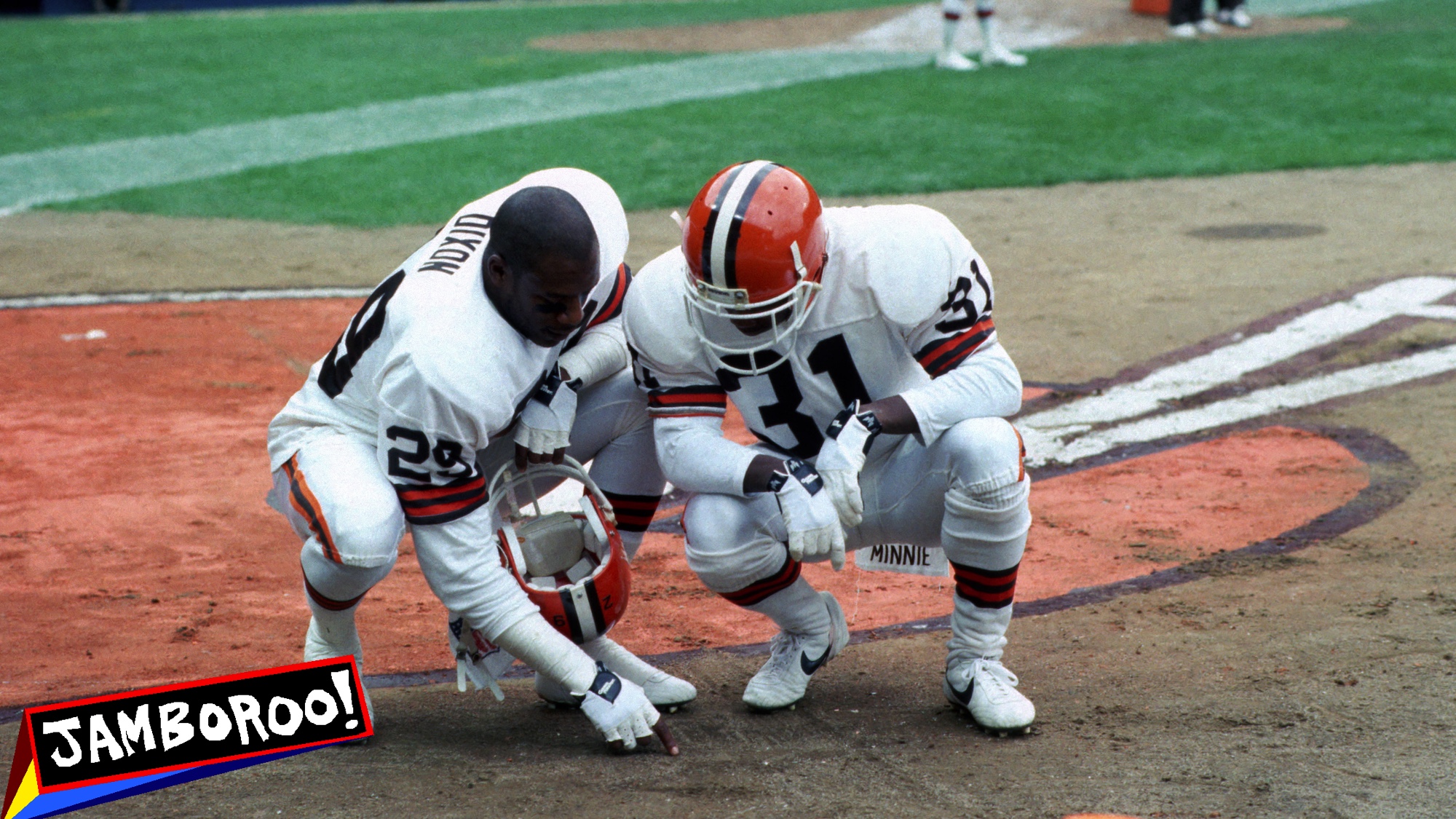 CLEVELAND - 1987: Defensive backs Hanford Dixon #29 and Frank Minnifield #31 of the Cleveland Browns draw plays in the dirt on the field before a game at Municipal Stadium circa 1987 in Cleveland, Ohio. (Photo by George Gojkovich/Getty Images)