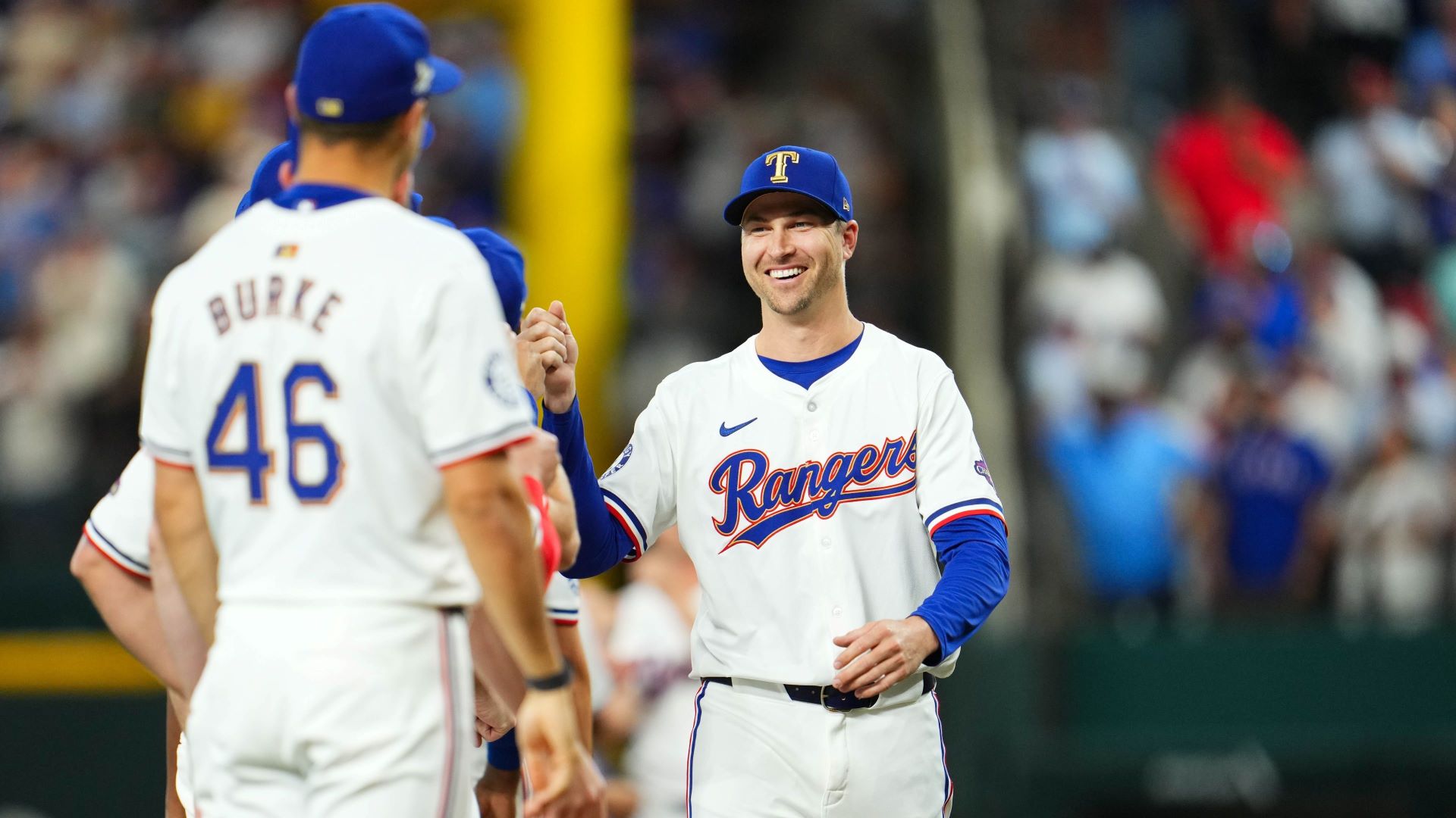 Jacob deGrom #48 of the Texas Rangers greets teammates on the field prior to the game between the Chicago Cubs and the Texas Rangers.