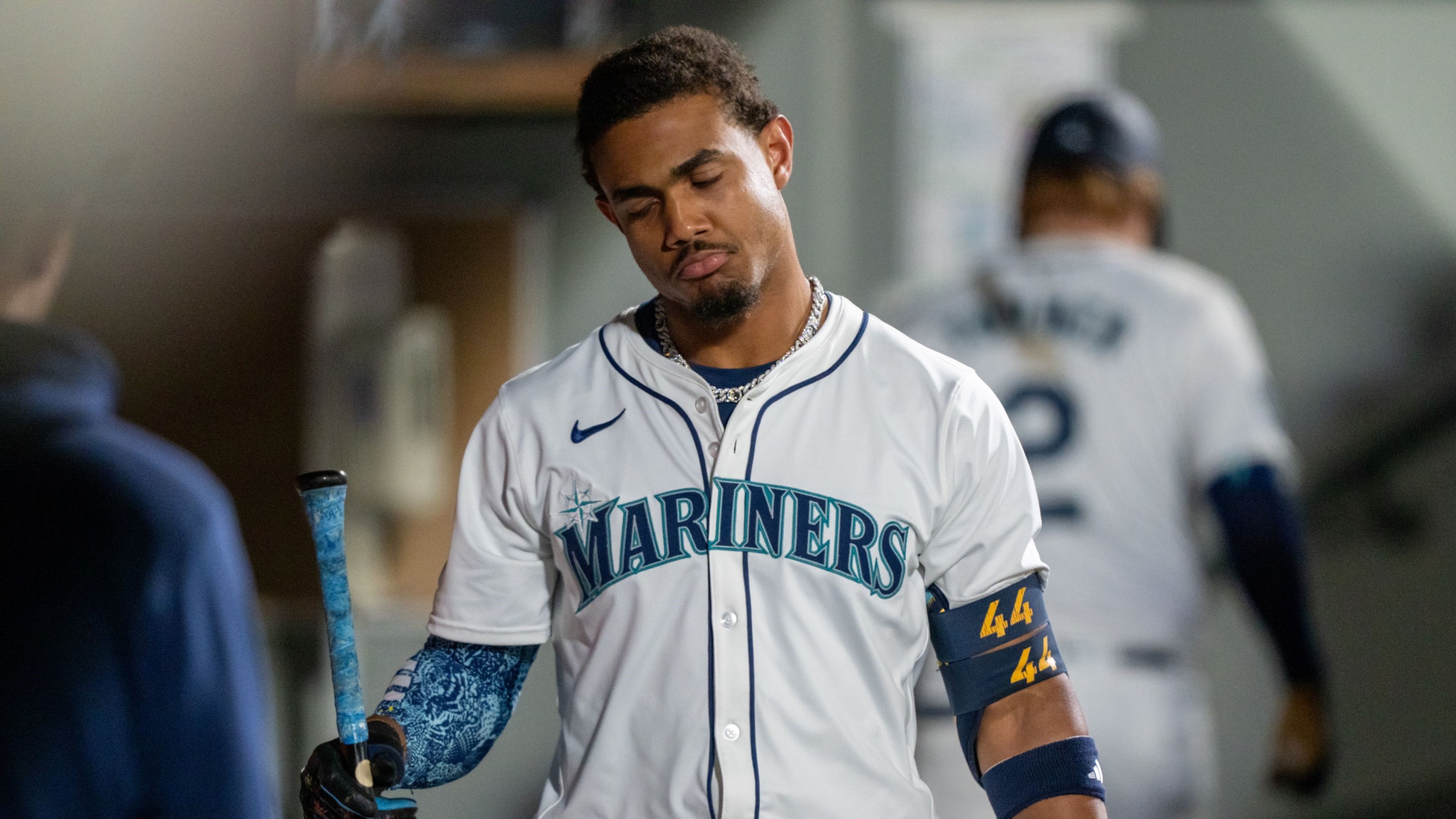 Julio Rodriguez #44 of the Seattle Mariners reacts in the dugout after striking out during the fifth inning of a game against the New York Yankees.