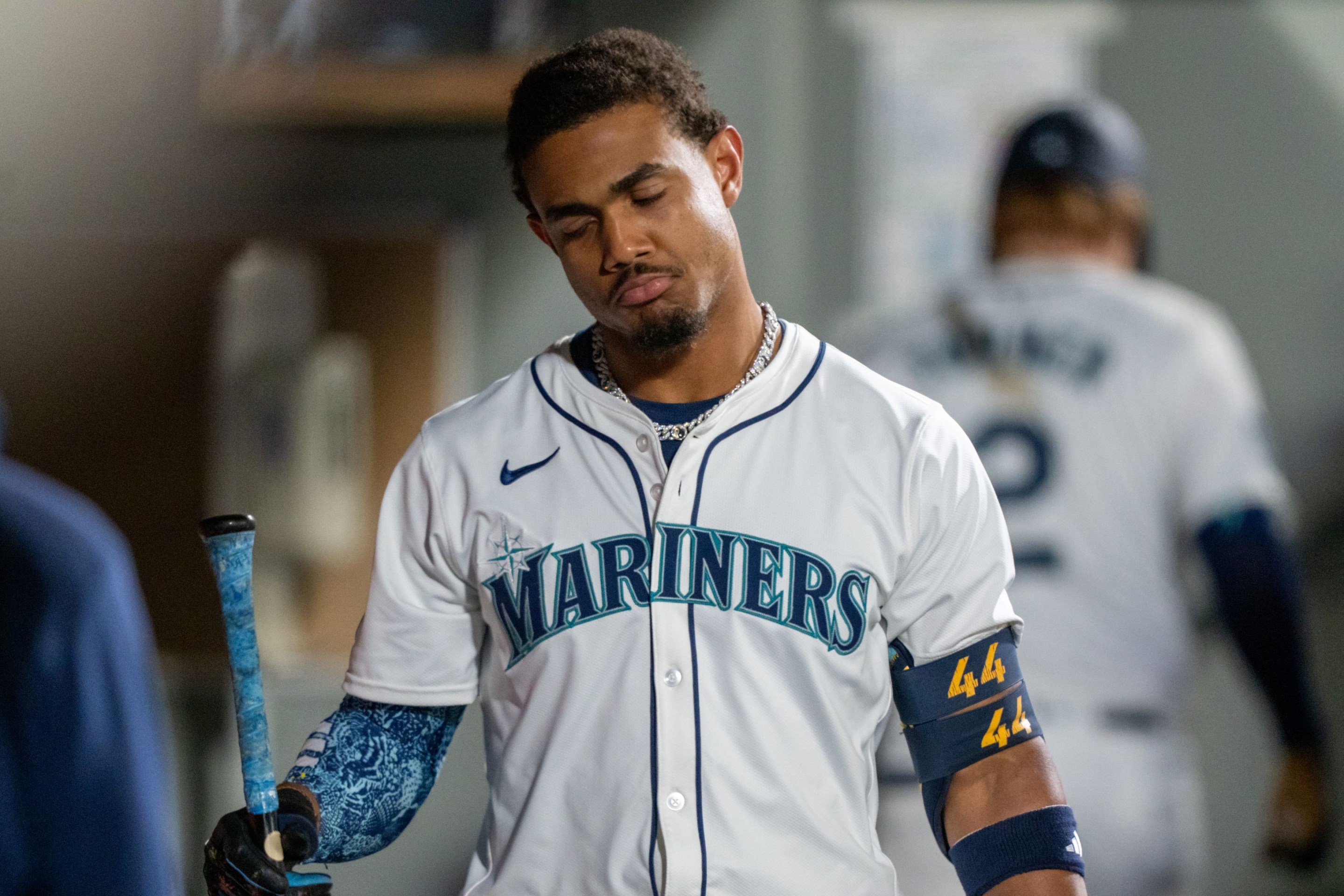 Julio Rodriguez #44 of the Seattle Mariners reacts in the dugout after striking out during the fifth inning of a game against the New York Yankees.