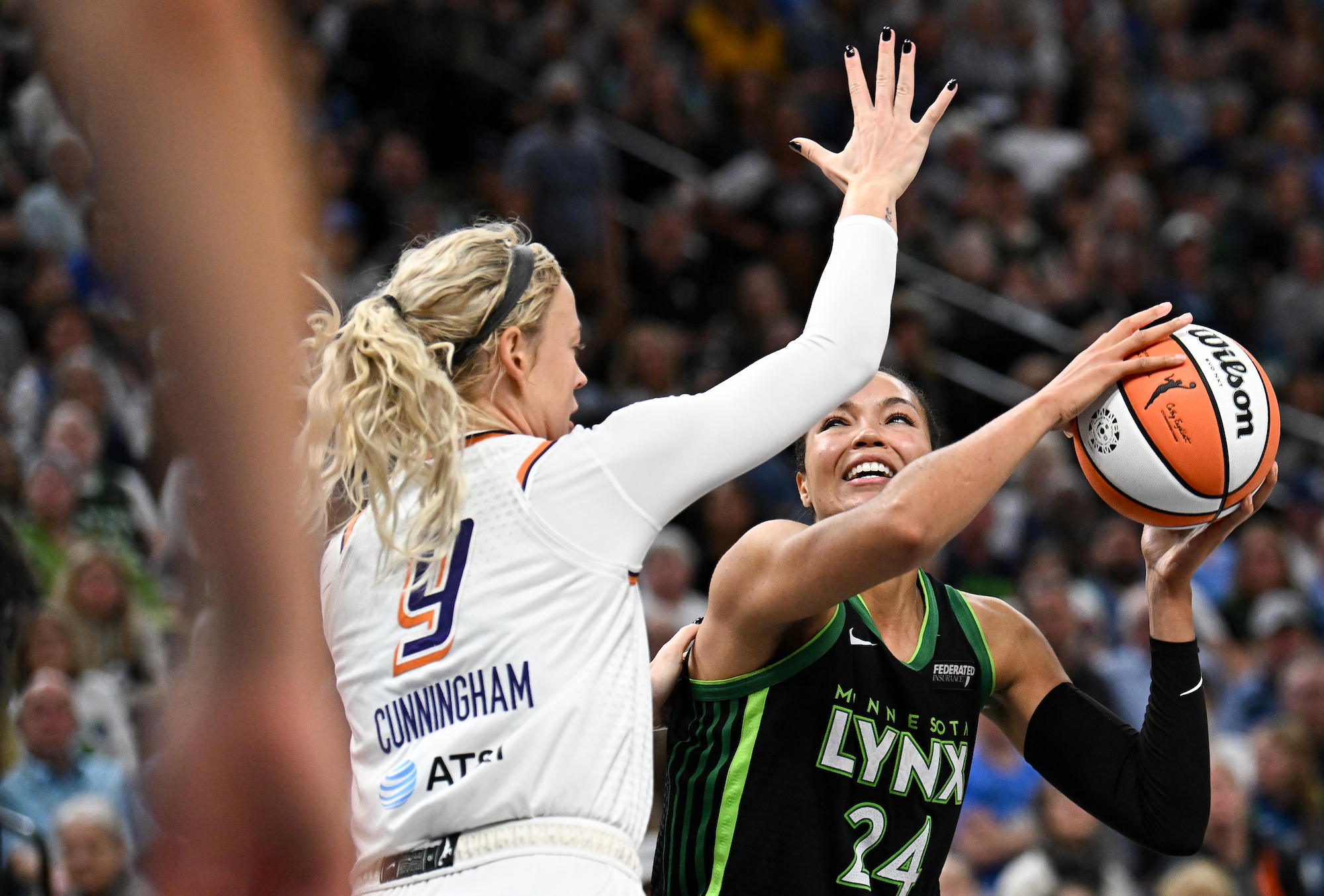 Napheesa Collier #24 of the Minnesota Lynx looks to shoot against Sophie Cunningham #9 of the Phoenix Mercury in the fourth quarter in Game Two