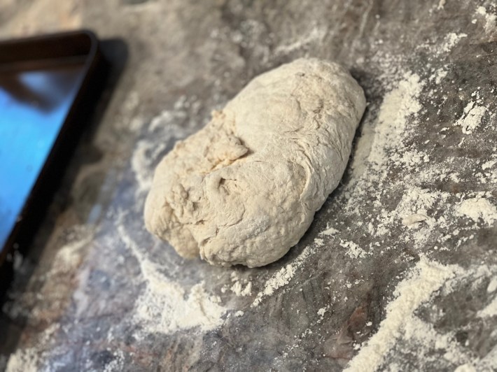 A gnarly blob of bread dough, before kneading.