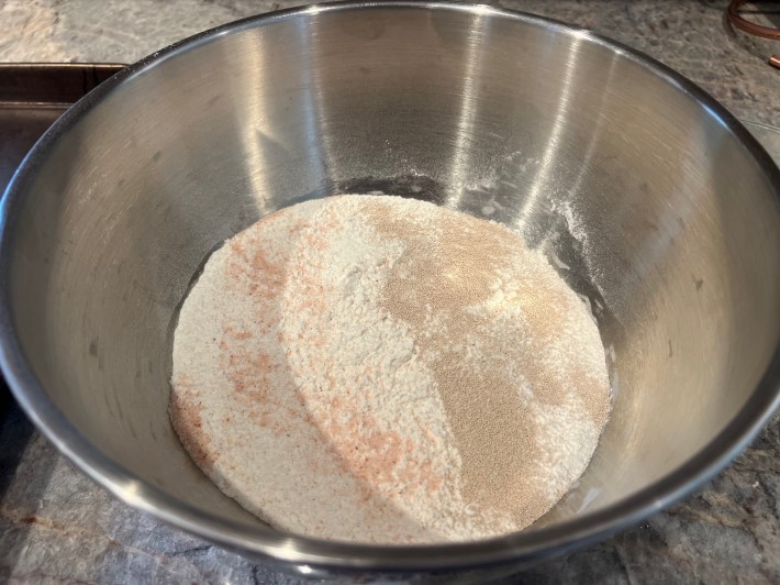 Flour, salt, and yeast in a large mixing bowl.