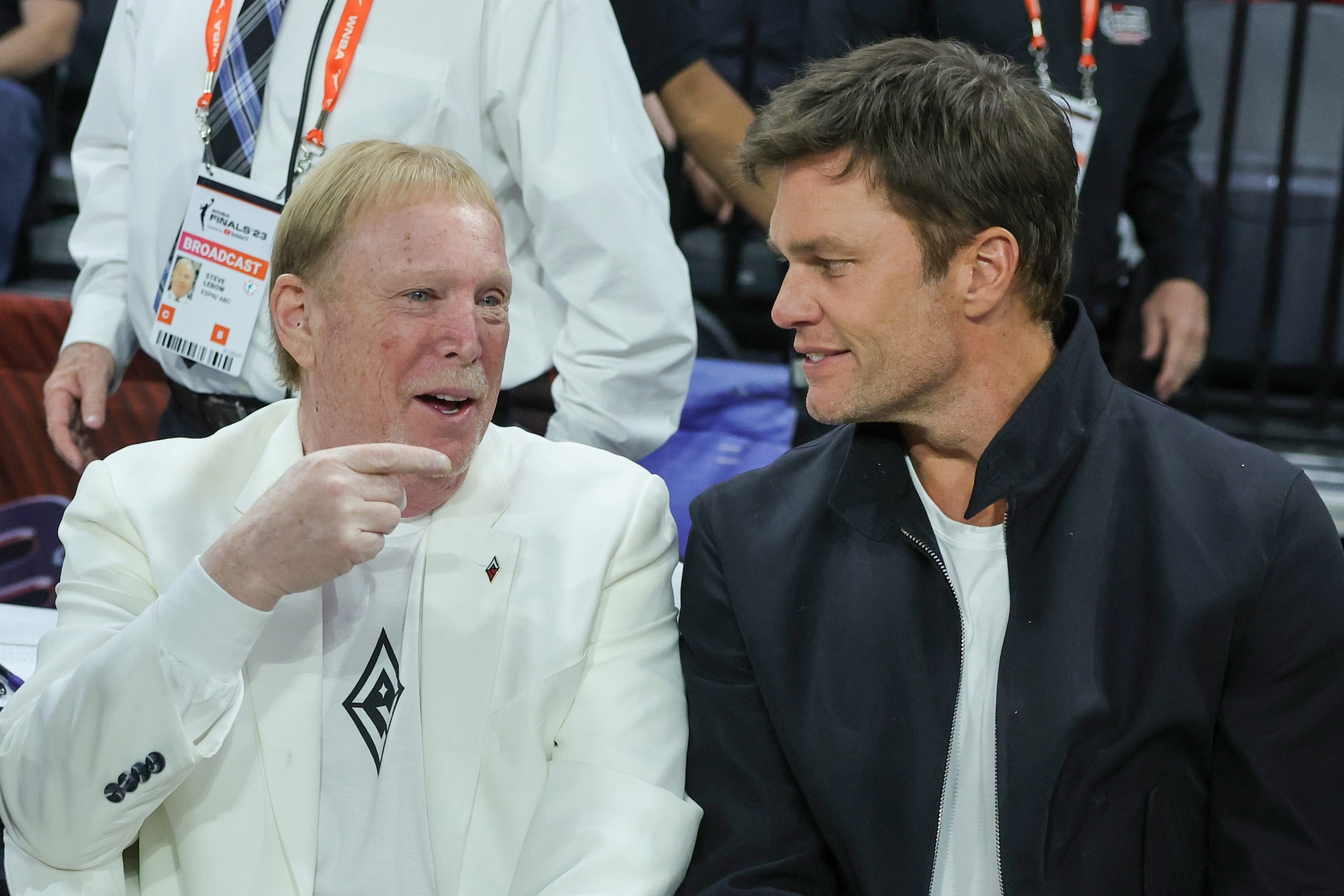 Las Vegas Raiders owner and managing general partner and Las Vegas Aces owner Mark Davis (L) and Tom Brady attend Game One of the 2023 WNBA Playoffs finals between the Aces and the New York Liberty. Brady looks kind of gaunt and pointy; Davis looks like Mark Davis.