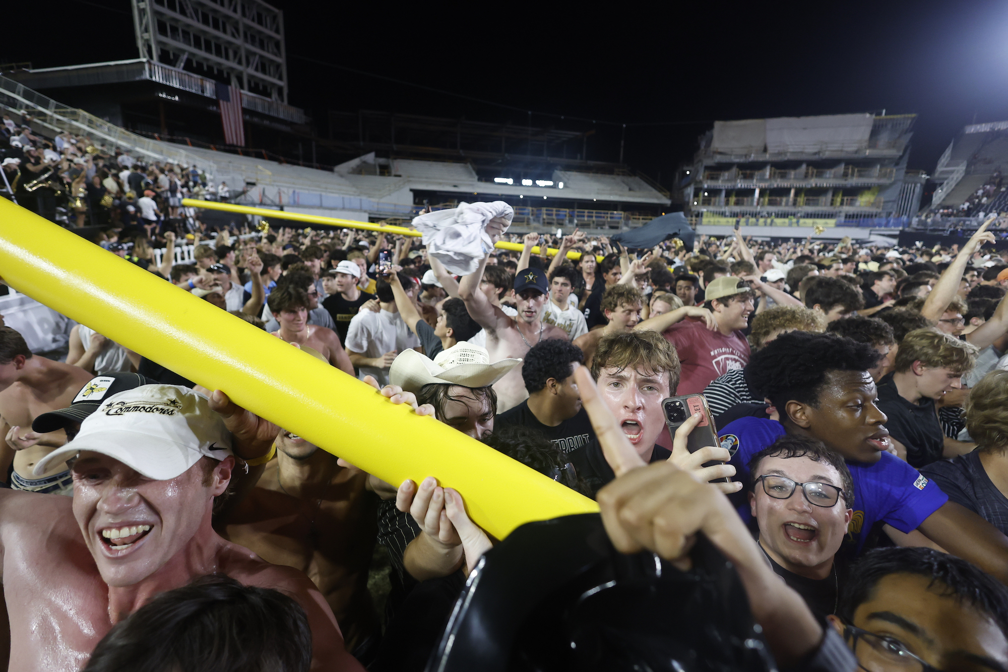 Vanderbilt Commodores fans march the goal posts around the field following a game between the Vanderbilt Commodores and Alabama Crimson Tide, October 5, 2024 at FirstBank Stadium in Nashville, Tennessee.