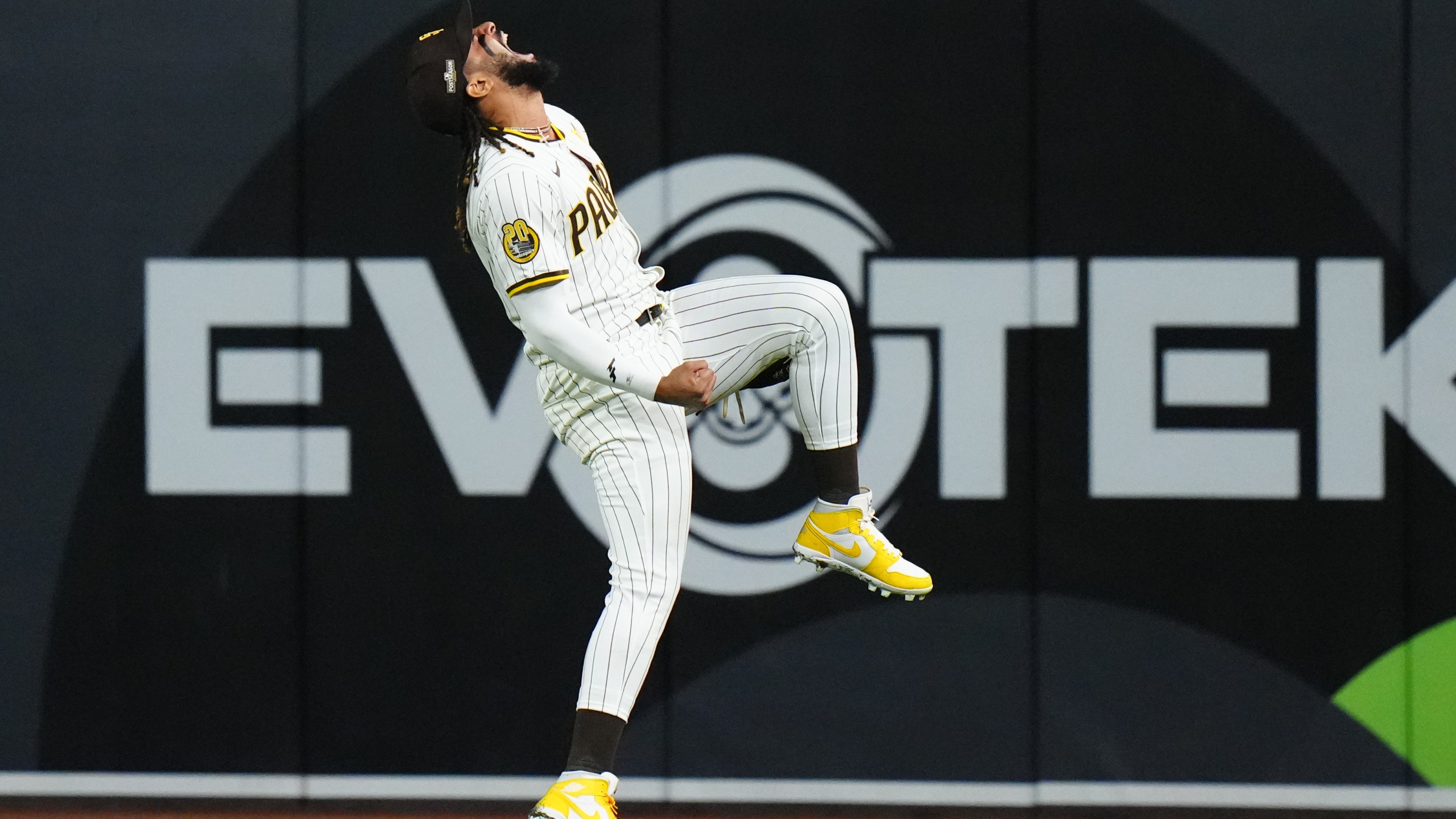 Fernando Tatis Jr. of the Padres screams triumphantly in the outfield at the end of his team's Game 3 win in the National League Divisional Series on October 8, 2024.