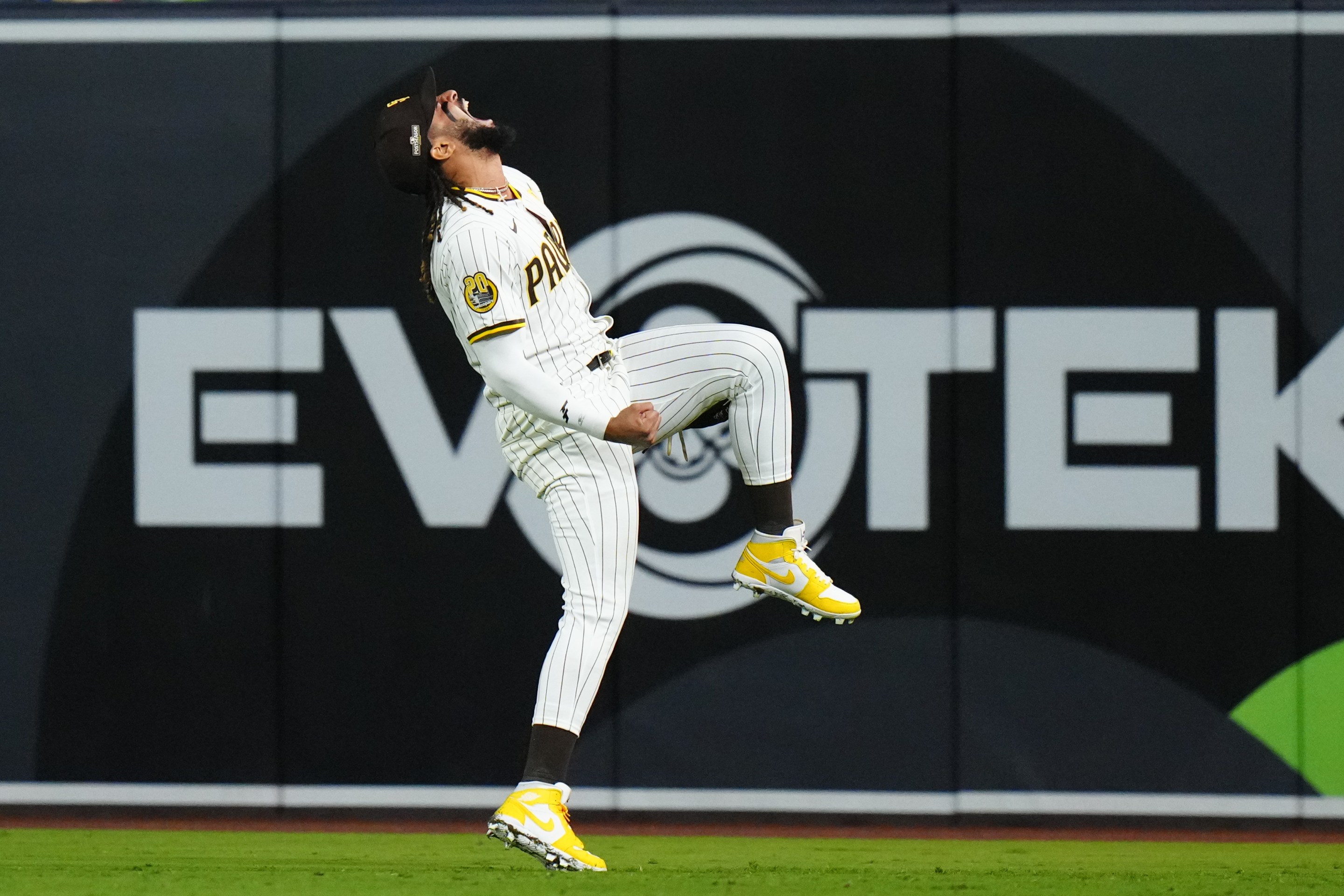 Fernando Tatis Jr. of the Padres screams triumphantly in the outfield at the end of his team's Game 3 win in the National League Divisional Series on October 8, 2024.