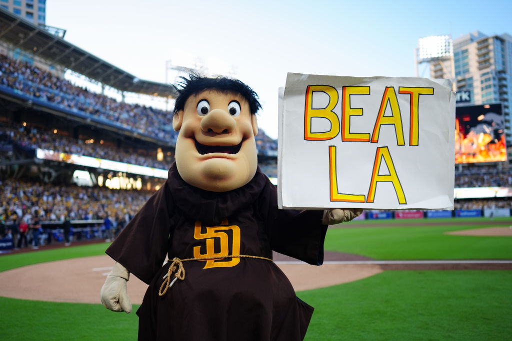 San Diego Padres mascot Swinging Friar poses with a "Beat LA" sign