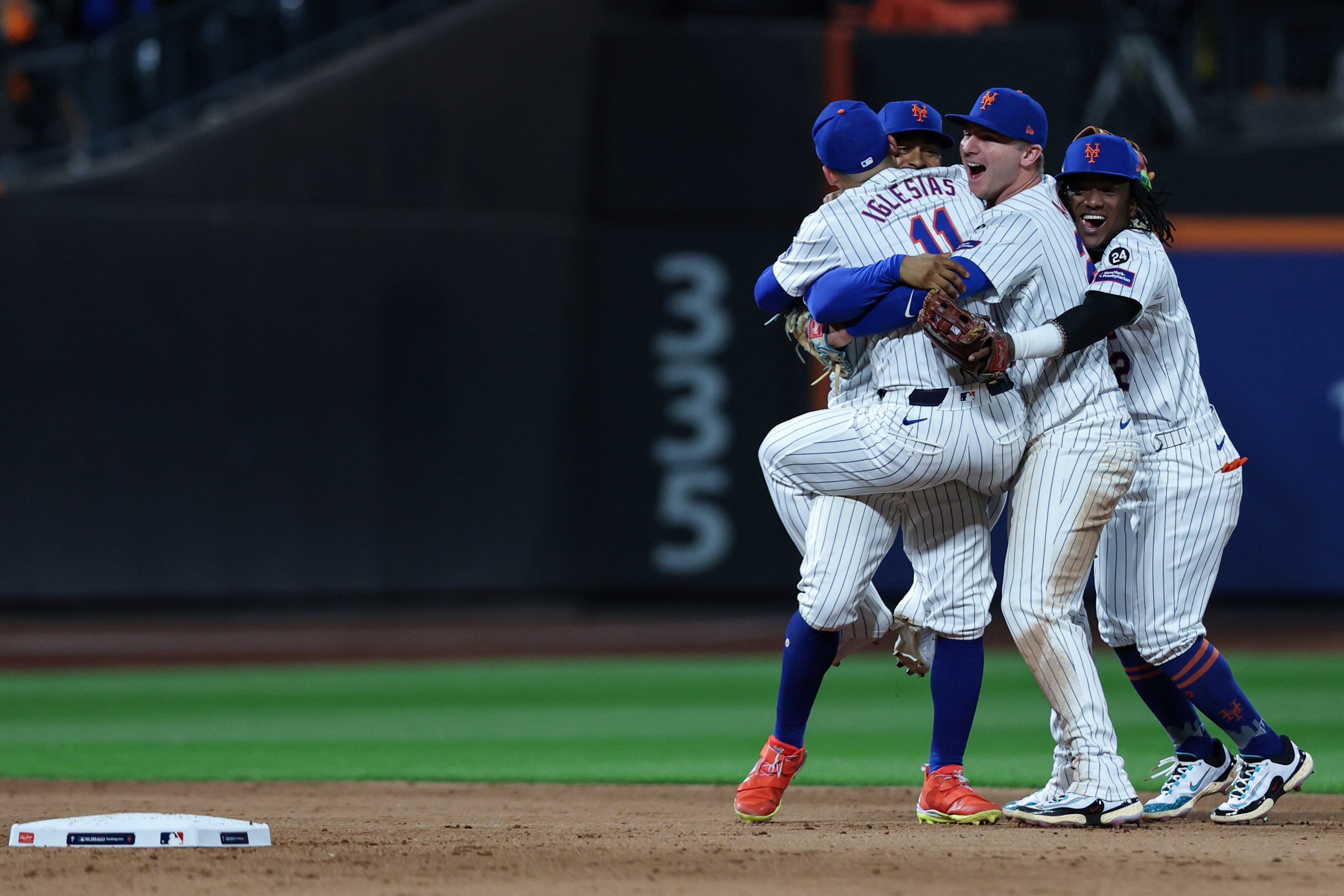 NEW YORK, NY - OCTOBER 09: The New York Mets celebrate after winning Game 4 of the Division Series presented by Booking.com between the Philadelphia Phillies and the New York Mets at Citi Field on Wednesday, October 9, 2024 in New York, New York. The New York Mets won 4-1 and will advance to the NLCS. (Photo by Rob Tringali/MLB Photos via Getty Images)