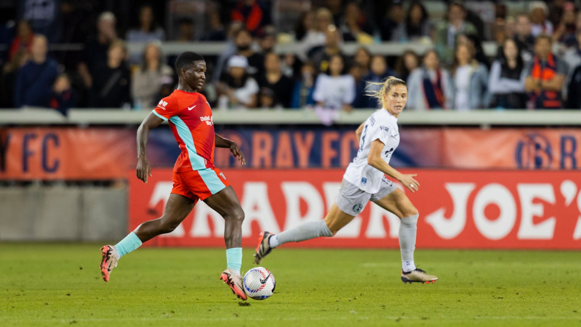 Forward Temwa Chawinga #6 of the Kansas City Current dribbles the ball with defender Abby Dahlkemper #13 of Bay FC defending in the second half during a game between Bay FC and the Kansas City Current at PayPal Park on October 12, 2024 in San Jose, California.