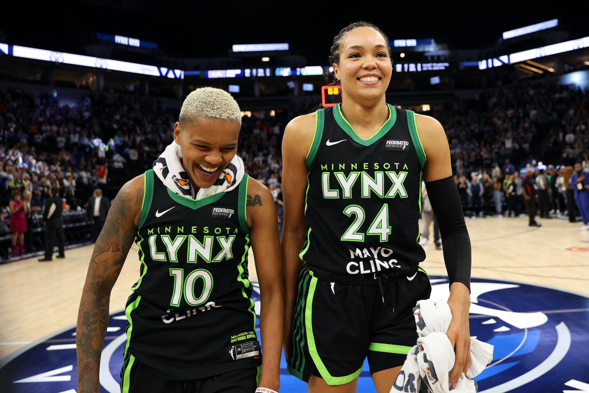 Courtney Williams #10 and Napheesa Collier #24 of the Minnesota Lynx celebrate their victory against the Connecticut Sun