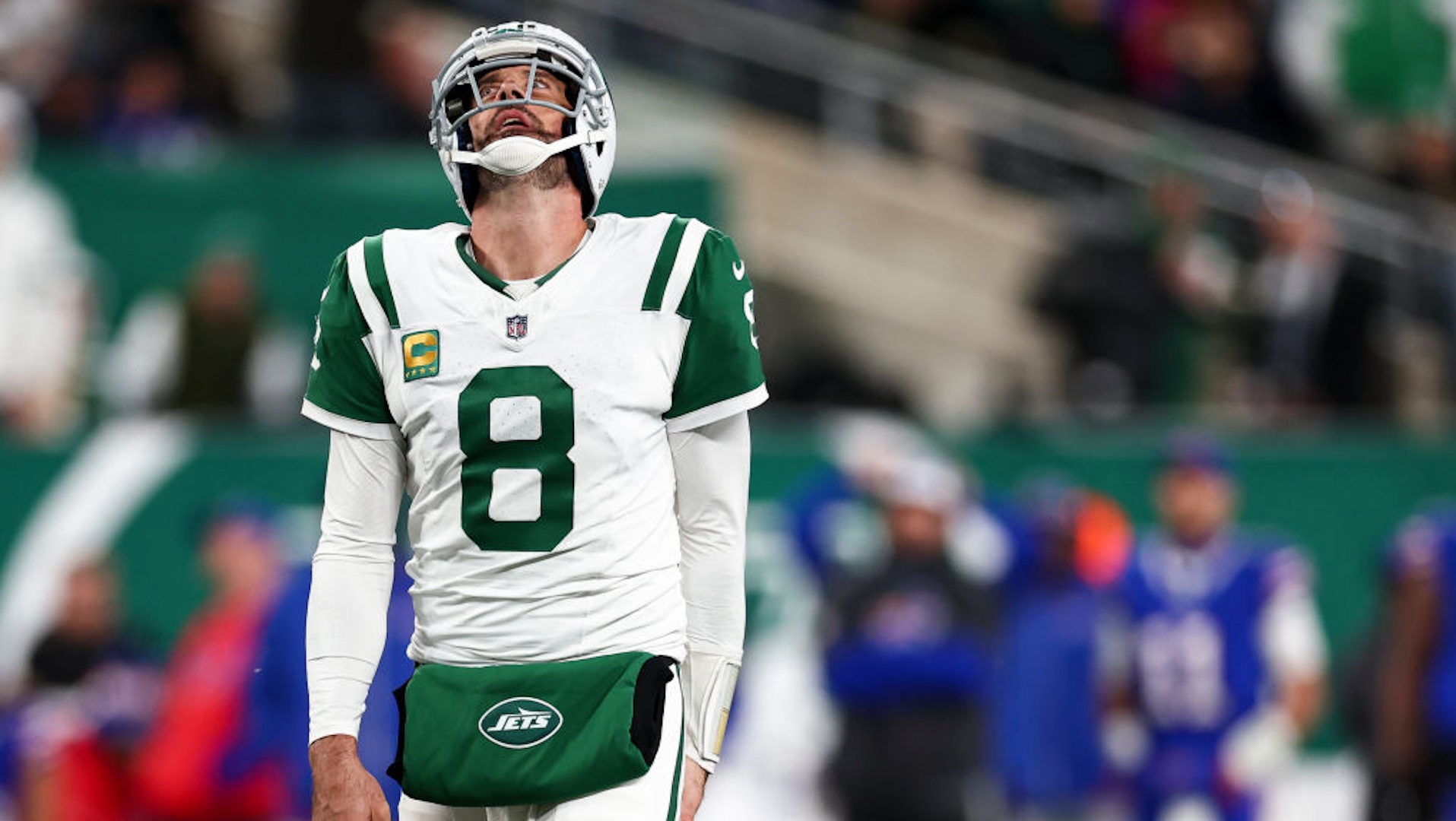 Aaron Rodgers #8 of the New York Jets reacts after a play during the second half of an NFL game against the Buffalo Bills at MetLife Stadium on October 14, 2024 in East Rutherford, New Jersey.