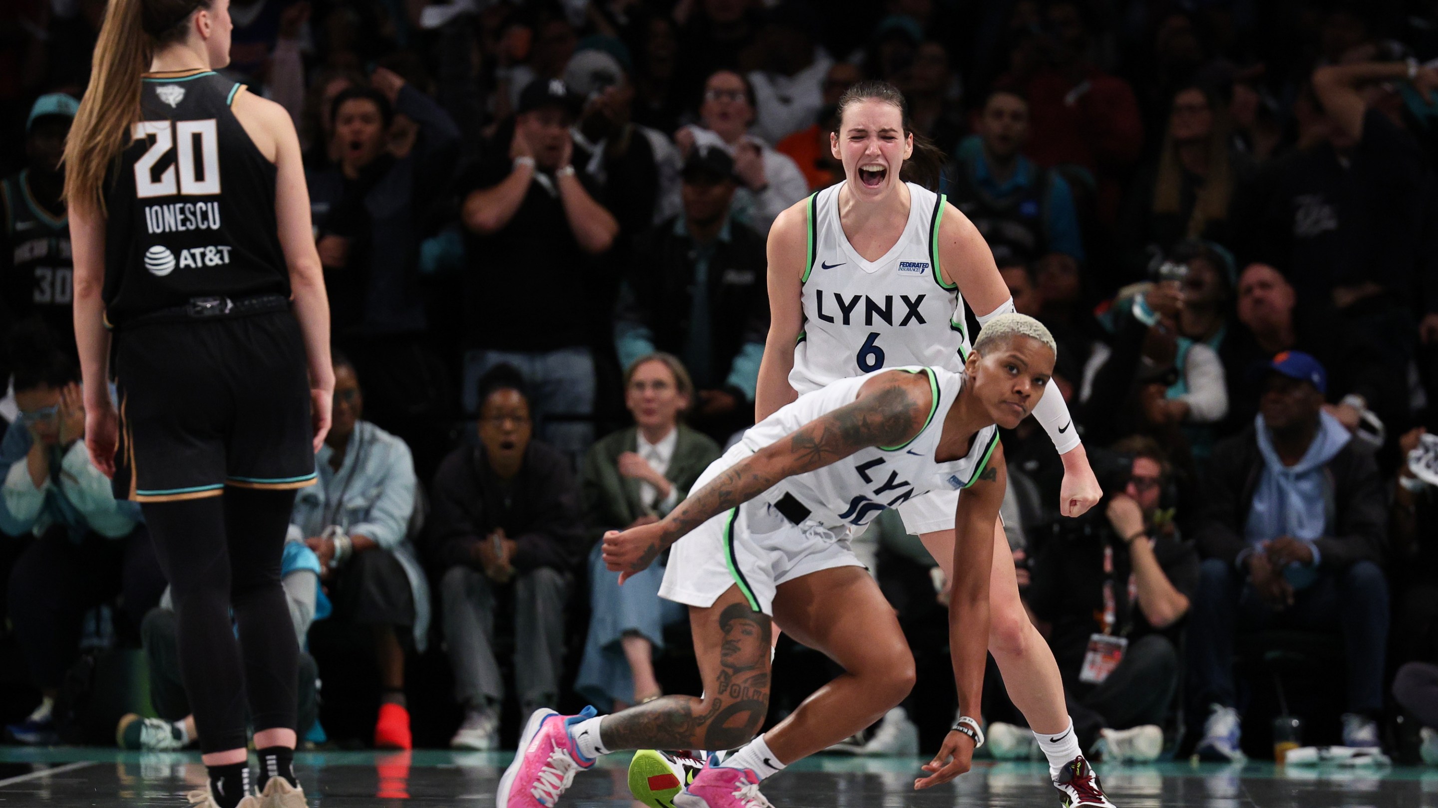 Courtney Williams #10 and Bridget Carleton #6 of the Minnesota Lynx react after being fouled during the second half against the New York Liberty during Game One of the WNBA Finals at the Barclays Center on October 10, 2024 in New York City.