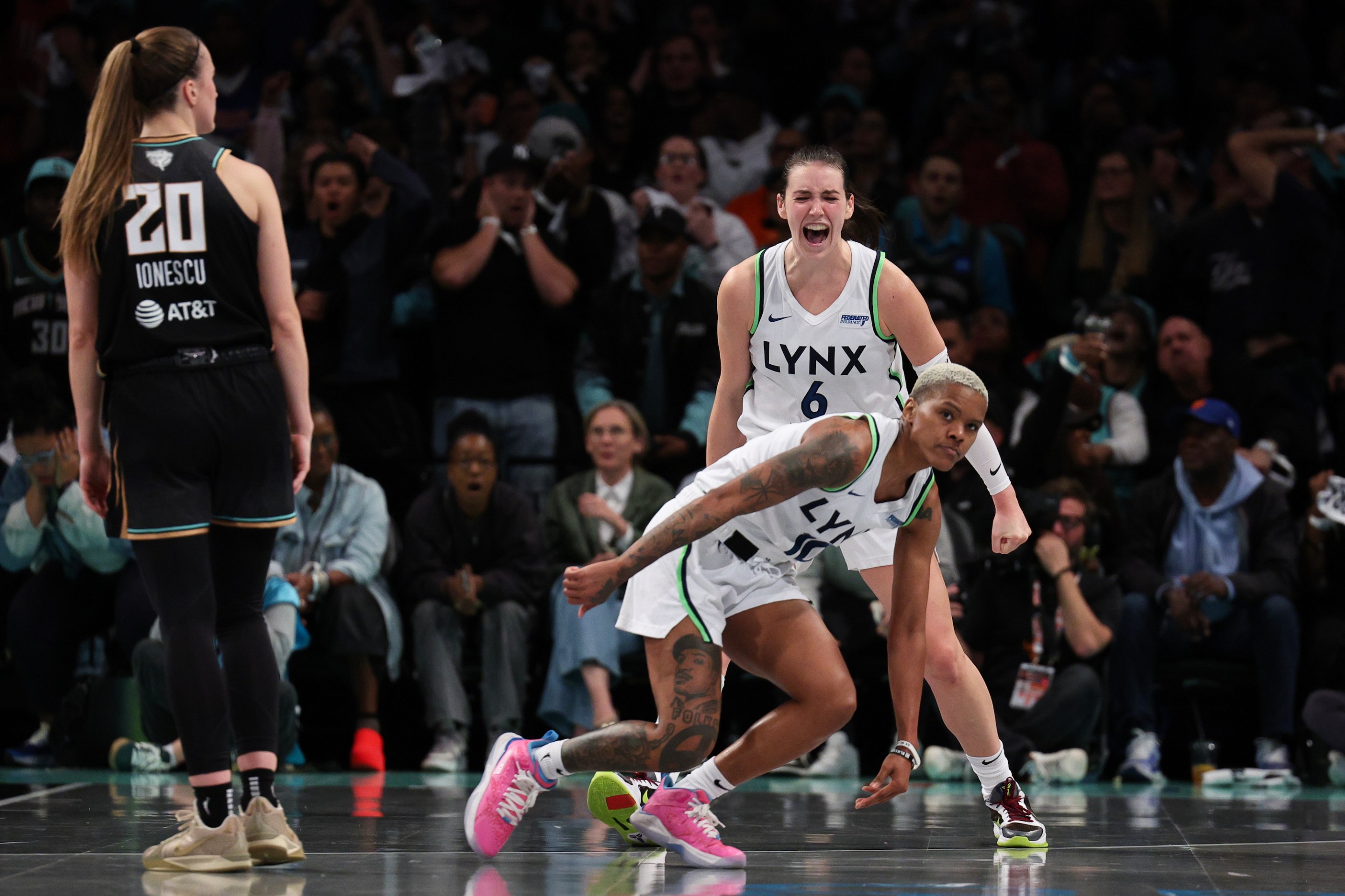 Courtney Williams #10 and Bridget Carleton #6 of the Minnesota Lynx react after being fouled during the second half against the New York Liberty during Game One of the WNBA Finals at the Barclays Center on October 10, 2024 in New York City.