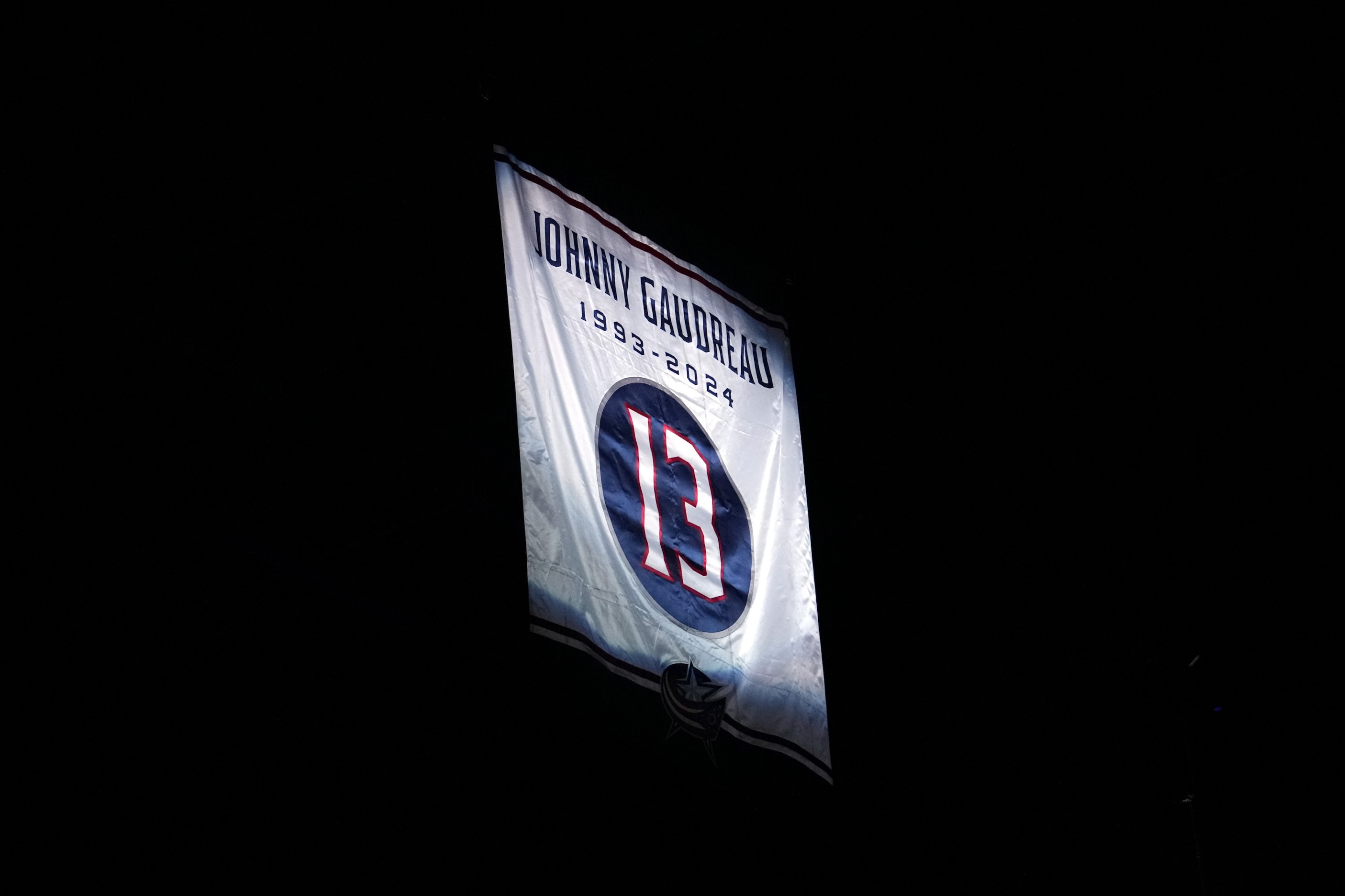 COLUMBUS, OHIO - OCTOBER 15: A banner honoring Columbus Blue Jackets player Johnny Gaudreau is raised to the rafters before a game against the Florida Panthers in the home opener at Nationwide Arena on October 15, 2024 in Columbus, Ohio. Gaudreau along with his brother Matthew were killed by a driver while biking in Salem County, New Jersey in August. at Nationwide Arena on October 15, 2024 in Columbus, Ohio. (Photo by Jason Mowry/Getty Images)