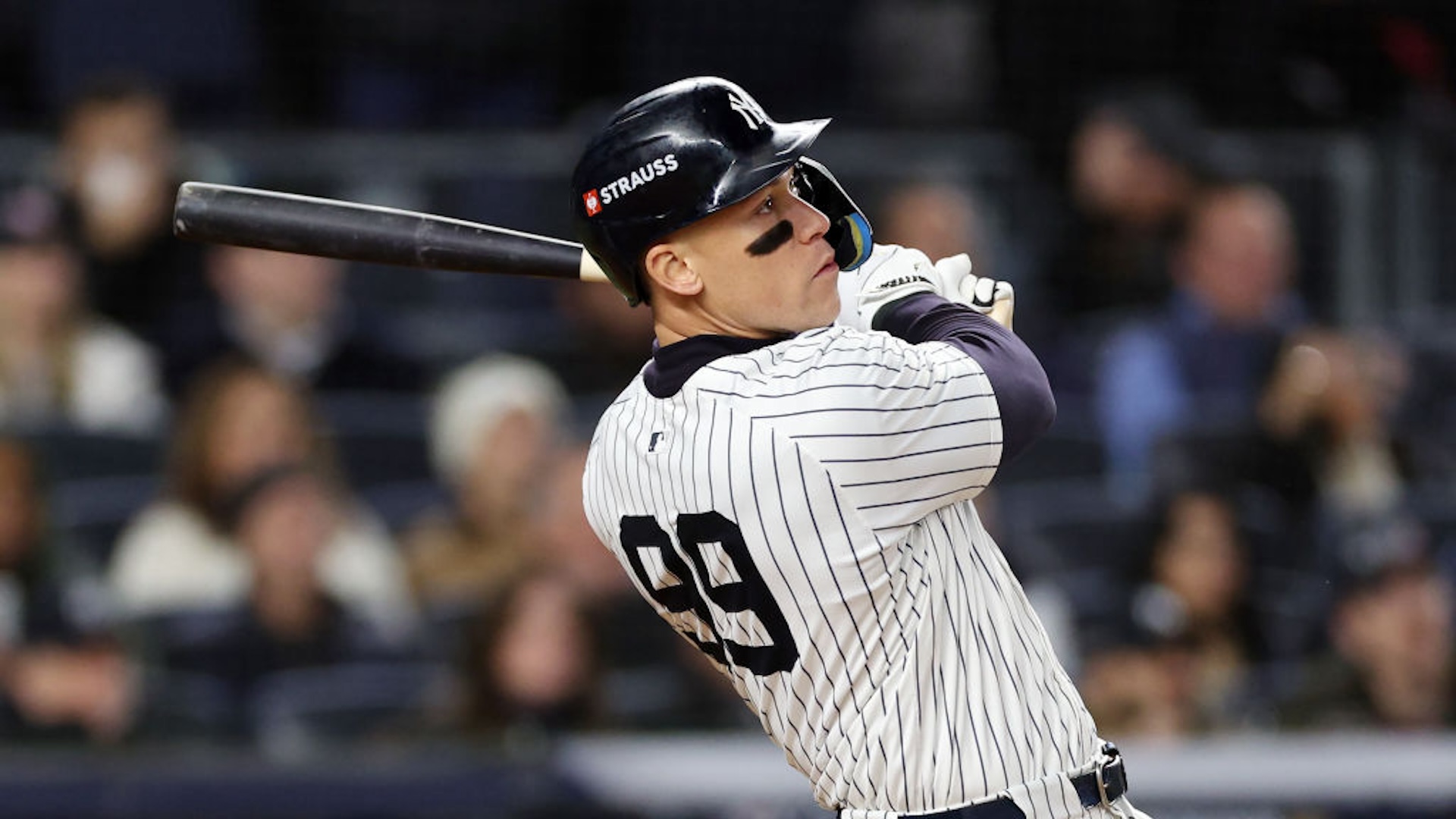 Aaron Judge #99 of the New York Yankees hits a two-run home run in the seventh inning against the Cleveland Guardians during Game Two of the American League Championship Series at Yankee Stadium on October 15, 2024 in New York City.