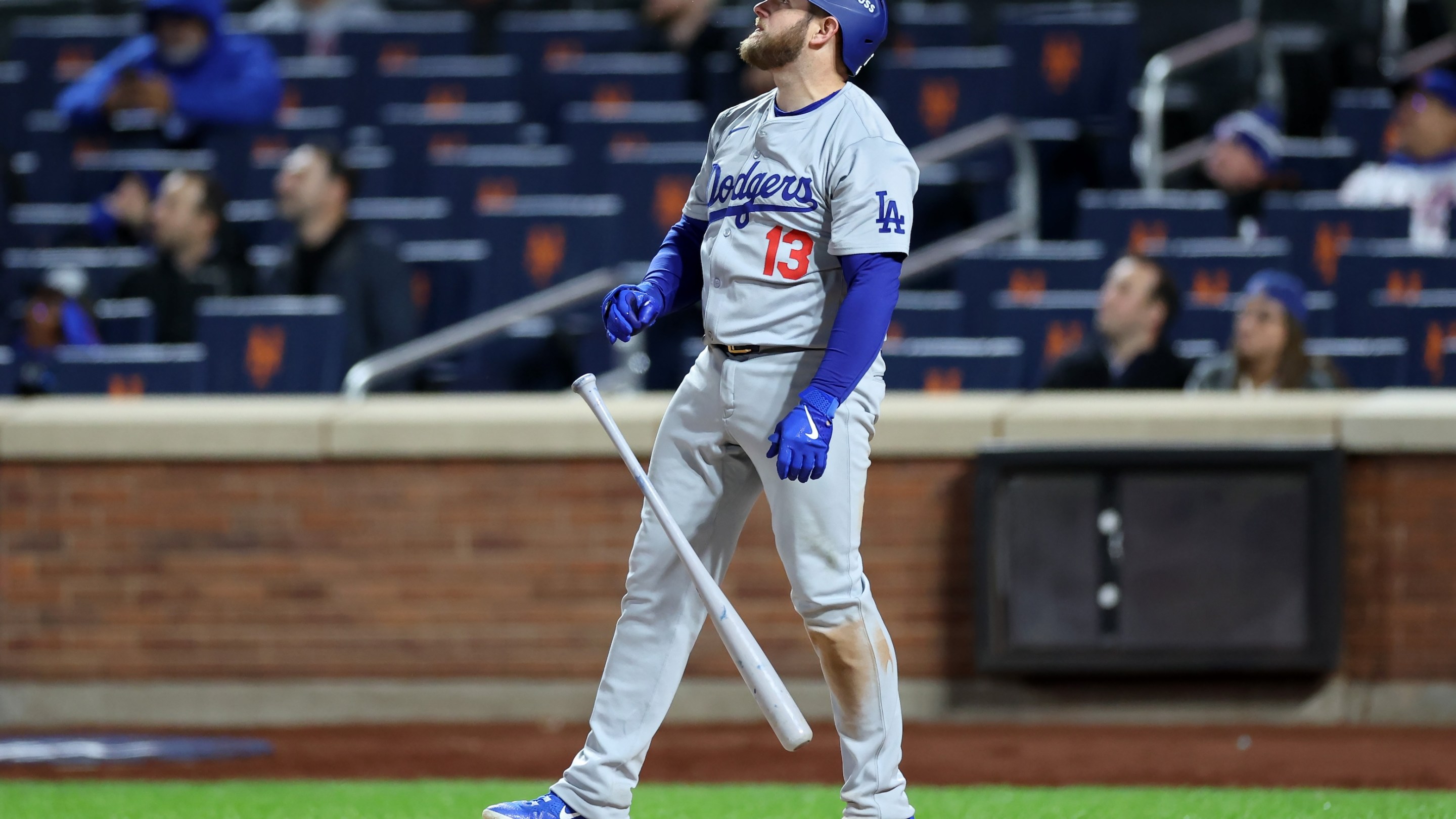 Max Muncy of the Los Angeles Dodgers watches his home run sail out to right field in Game 3 of the NLCS in New York.