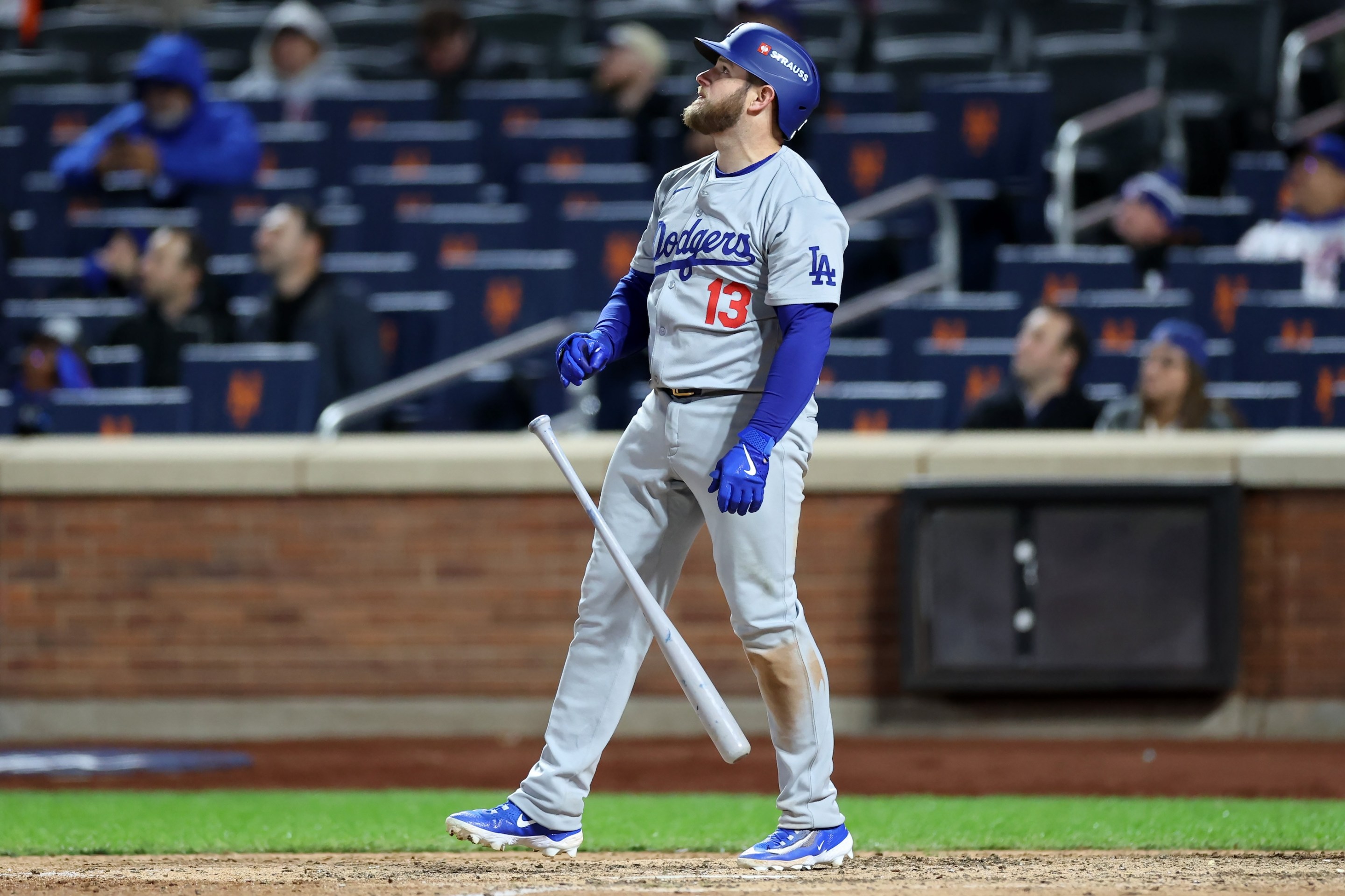 Max Muncy of the Los Angeles Dodgers watches his home run sail out to right field in Game 3 of the NLCS in New York.