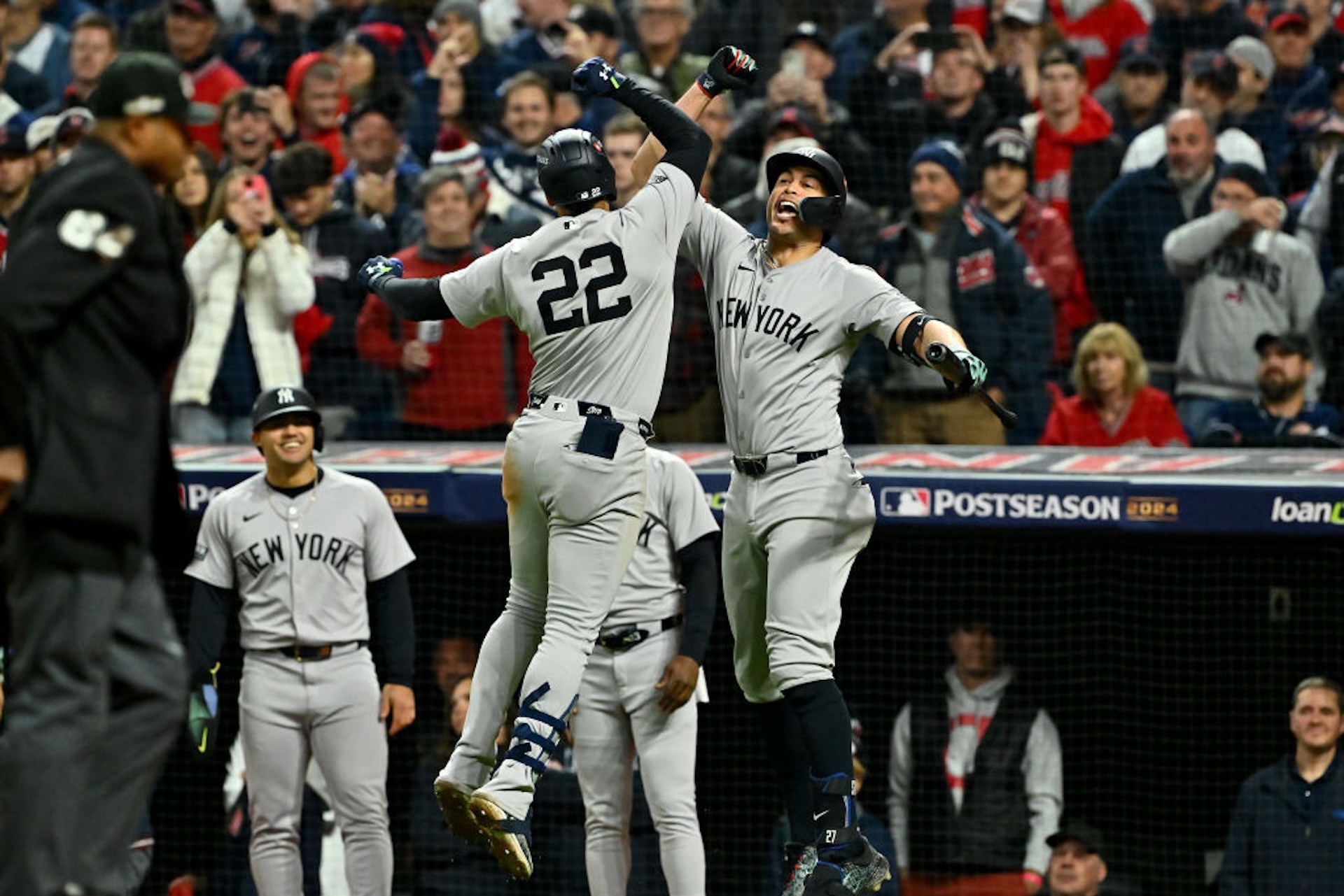 Juan Soto #22 and Aaron Judge #99 of the New York Yankees celebrate after Soto hit a home run in the 10th inning against the Cleveland Guardians during Game Five of the American League Championship Series at Progressive Field on October 19, 2024 in Cleveland, Ohio.