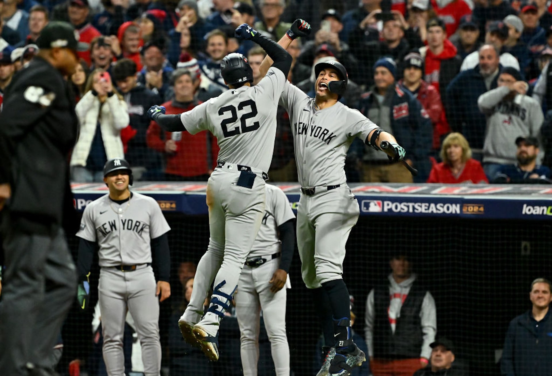Juan Soto #22 and Aaron Judge #99 of the New York Yankees celebrate after Soto hit a home run in the 10th inning against the Cleveland Guardians during Game Five of the American League Championship Series at Progressive Field on October 19, 2024 in Cleveland, Ohio.