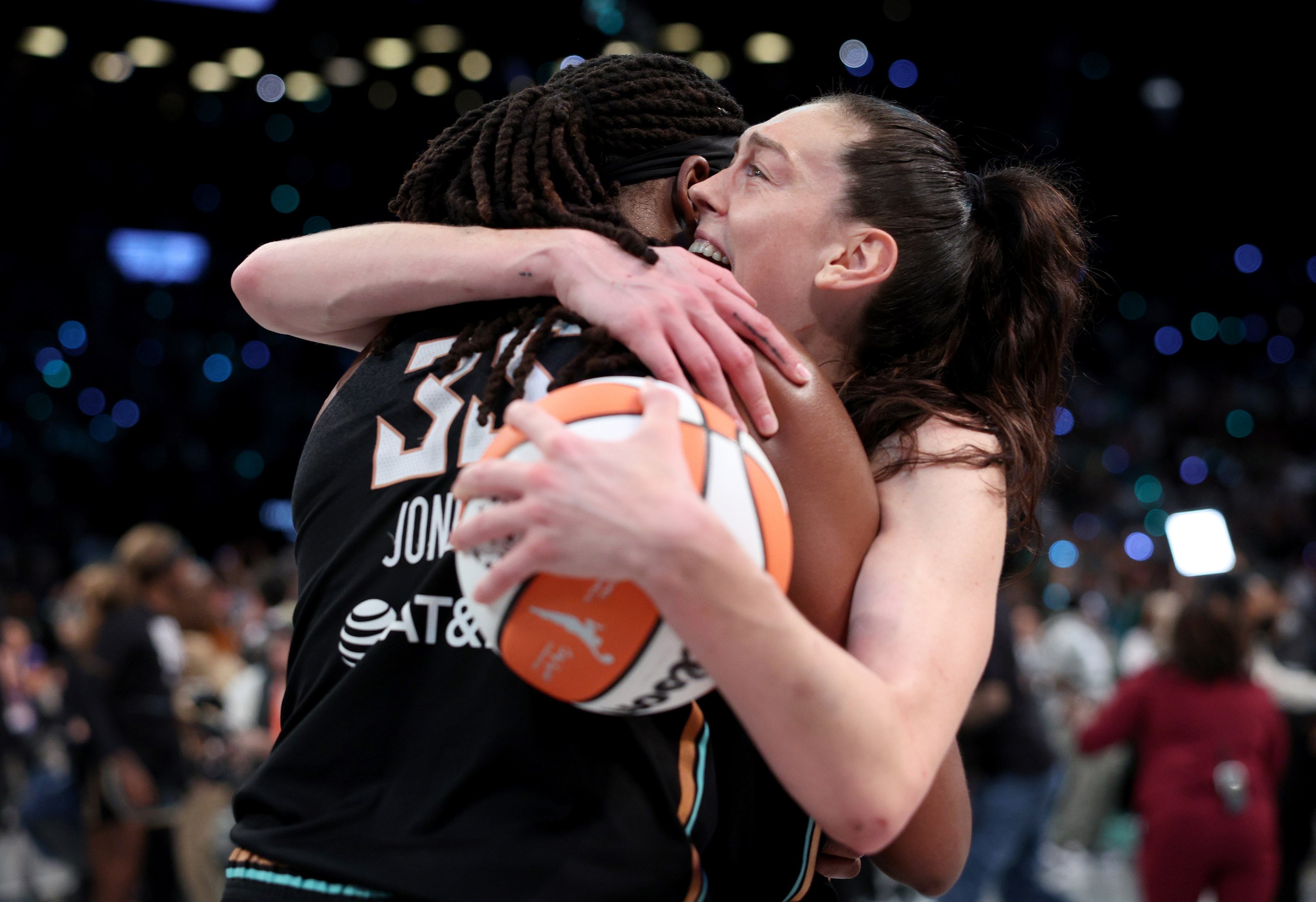 Jonquel Jones #35 and Breanna Stewart #30 of the New York Liberty celebrate after winning Game Five of the WNBA Finals against the Minnesota Lynx at Barclays Center on October 20, 2024 in the Brooklyn borough of New York City. The New York Liberty defeated the Minnesota Lynx 67-62 in overtime to win the championship.