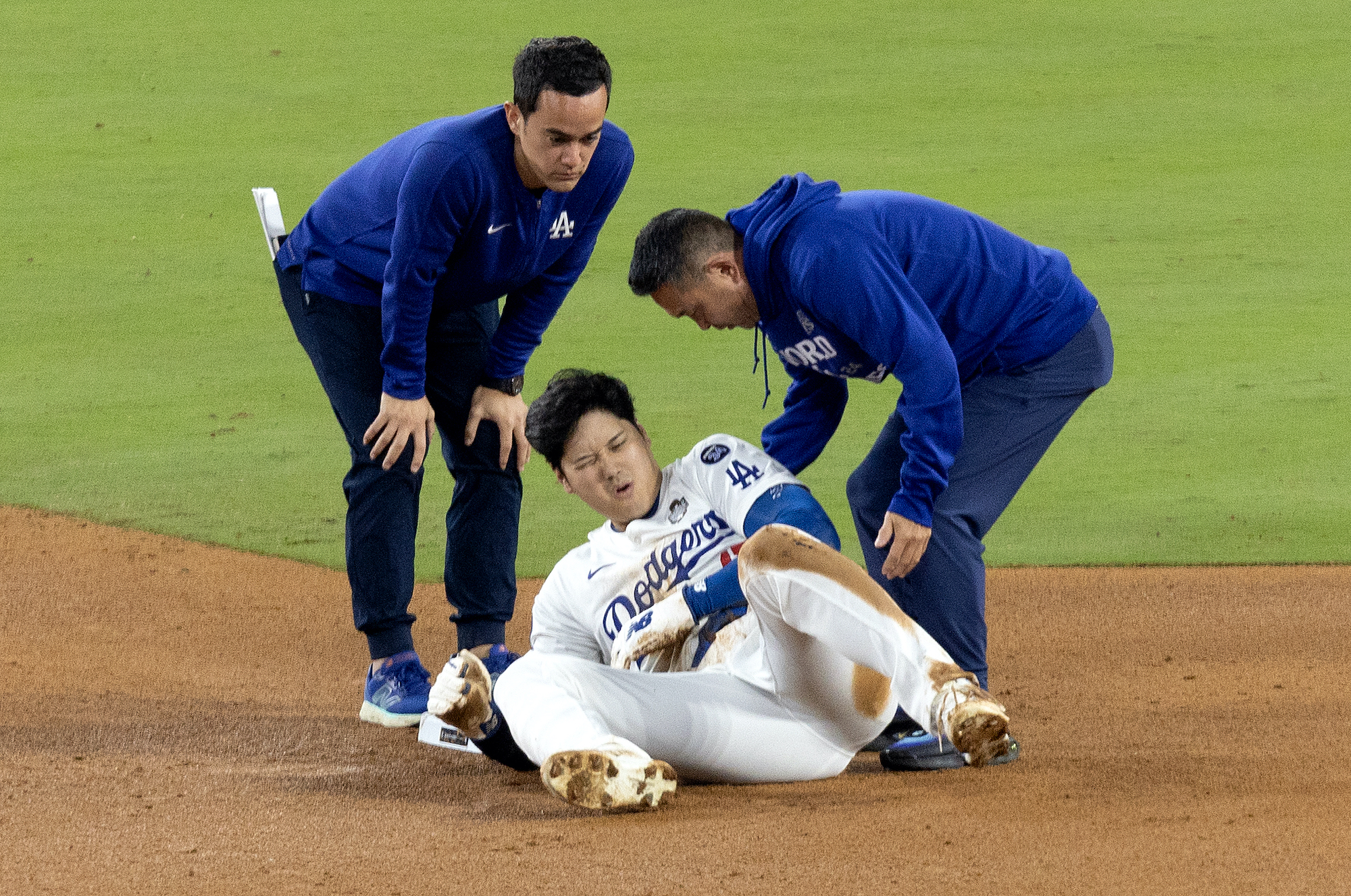 Dodgers star Shohei Ohtani sustains a shoulder injury while trying to seal second base during the seventh inning of the Dodgers' 4-2 win over the Yankees in Game 2 of the World Series