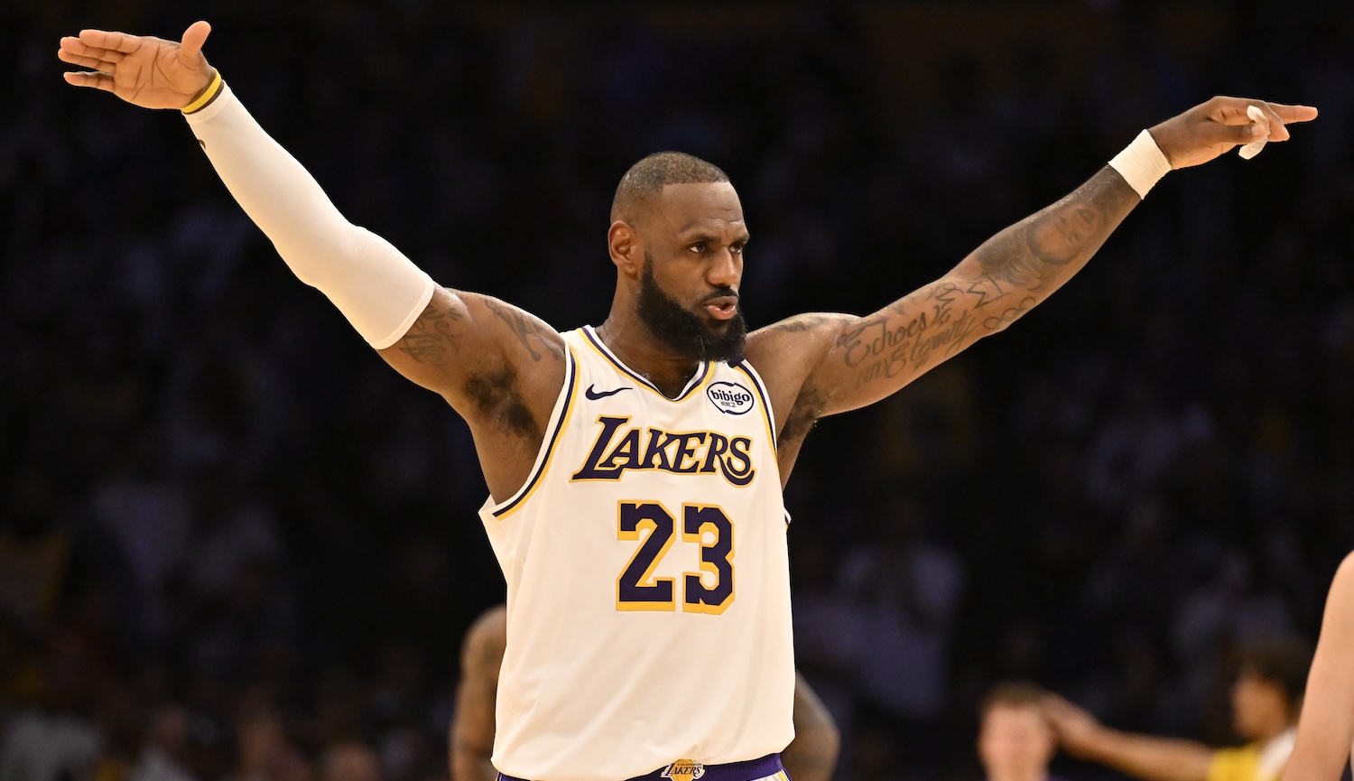 LeBron James #23 of the Los Angeles Lakers asks for the crowd to quiet down as Anthony Davis #3 shots free throws against the Sacramento Kings in the fourth quarter