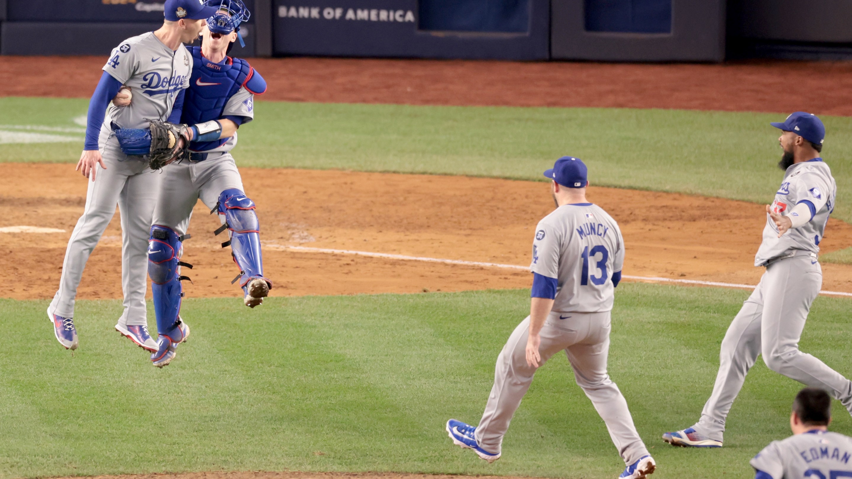 Teammates celebrate with "Los Angeles Dodgers pitcher Walker Buehler (21), left, after winning the World Series. Game 5 of the World Series against the Yankees at Yankees Stadium in New York City Wednesday, October 30, 2024.