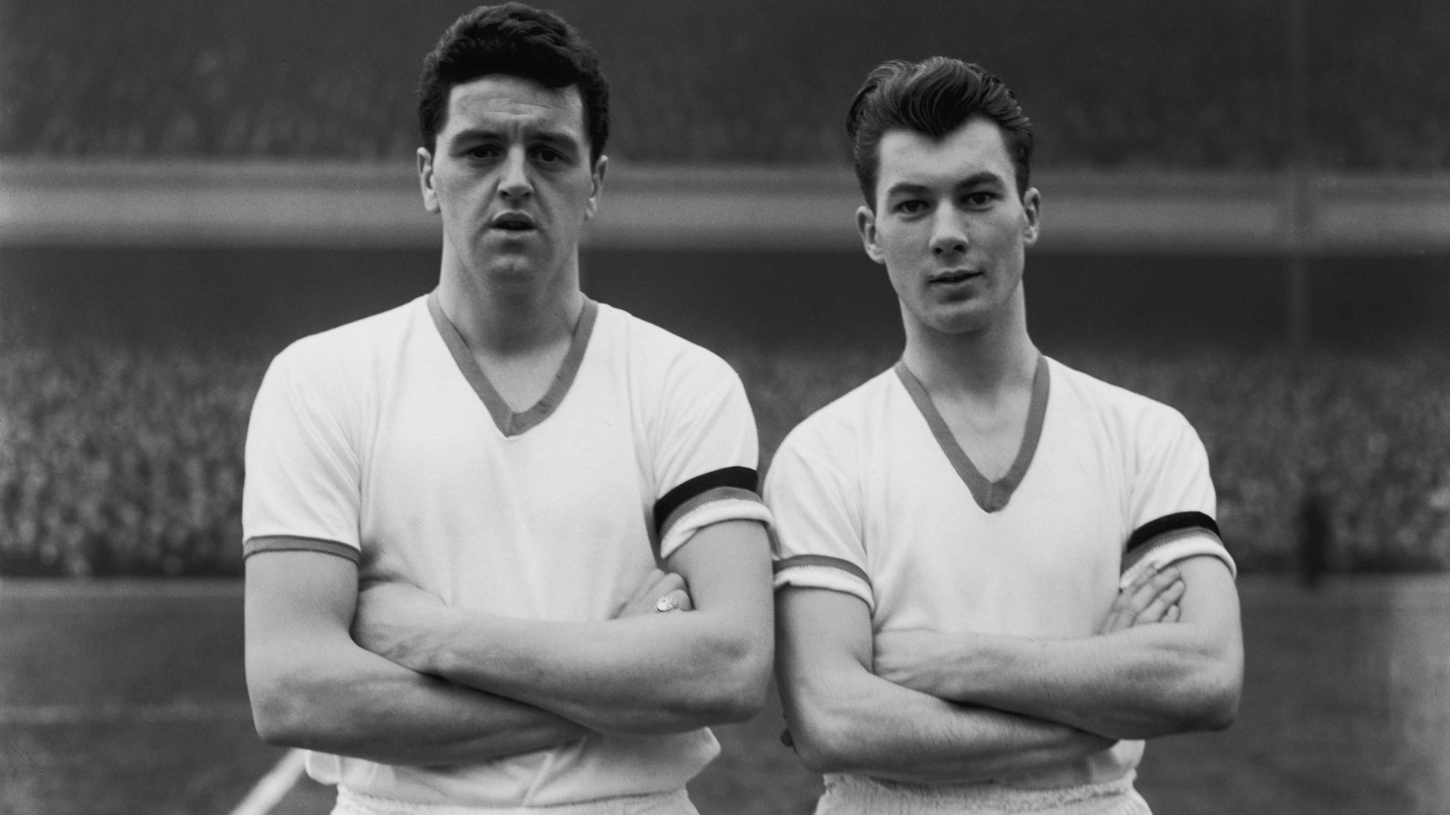 Manchester United players Tommy Taylor, left, and Ken Morgans, line up before playing Arsenal at their Highbury Stadium, 1st February 1958. This was Taylor's last match, he died in the plane crash that killed 8 of the Busby Babes team in Munich less than a week later.