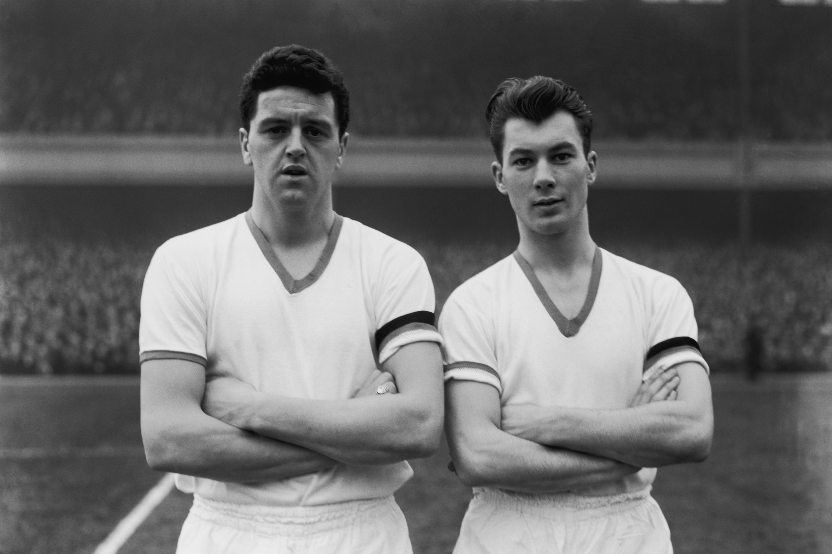 Manchester United players Tommy Taylor, left, and Ken Morgans, line up before playing Arsenal at their Highbury Stadium, 1st February 1958. This was Taylor's last match, he died in the plane crash that killed 8 of the Busby Babes team in Munich less than a week later.