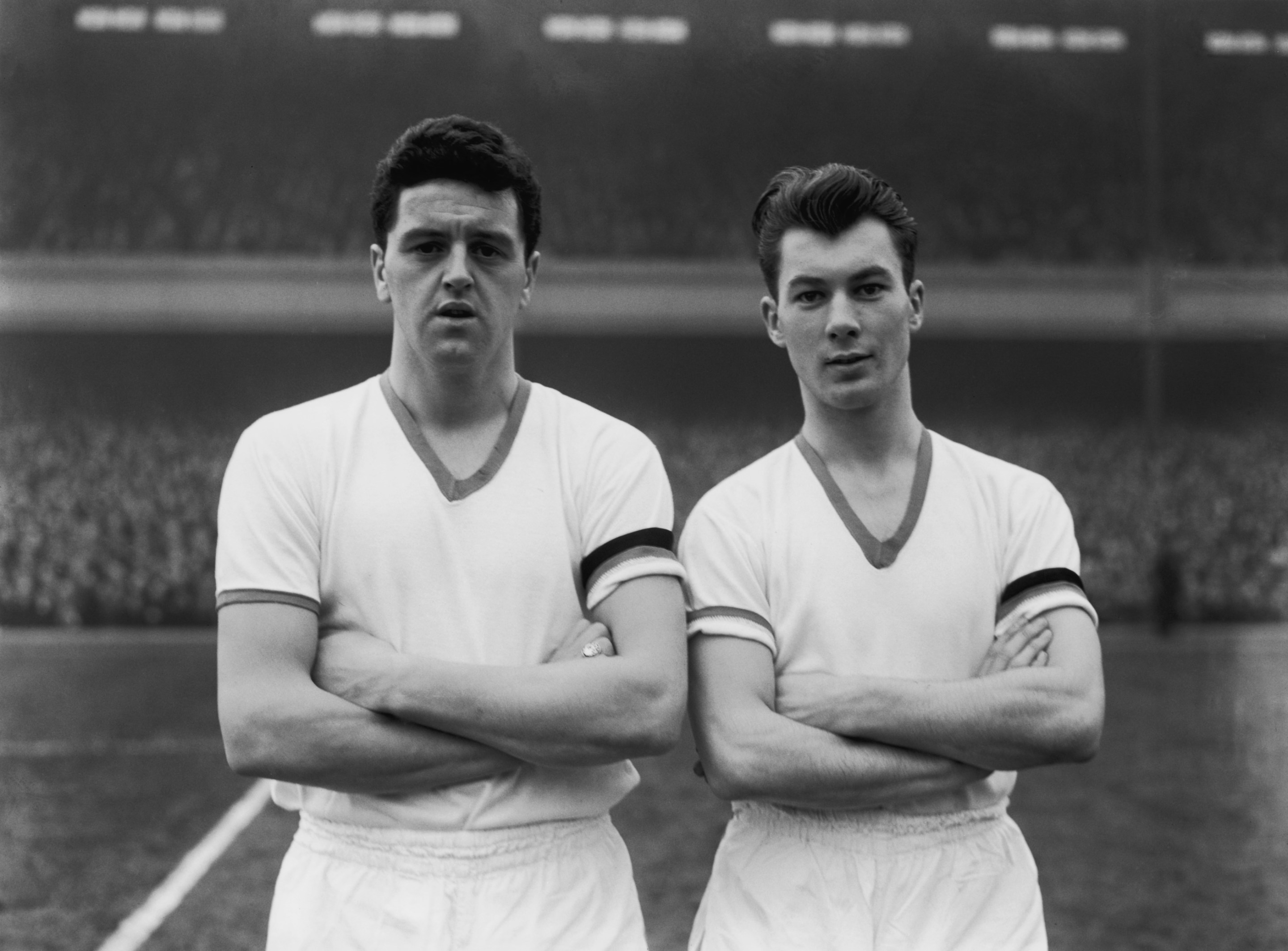 Manchester United players Tommy Taylor, left, and Ken Morgans, line up before playing Arsenal at their Highbury Stadium, 1st February 1958. This was Taylor's last match, he died in the plane crash that killed 8 of the Busby Babes team in Munich less than a week later.