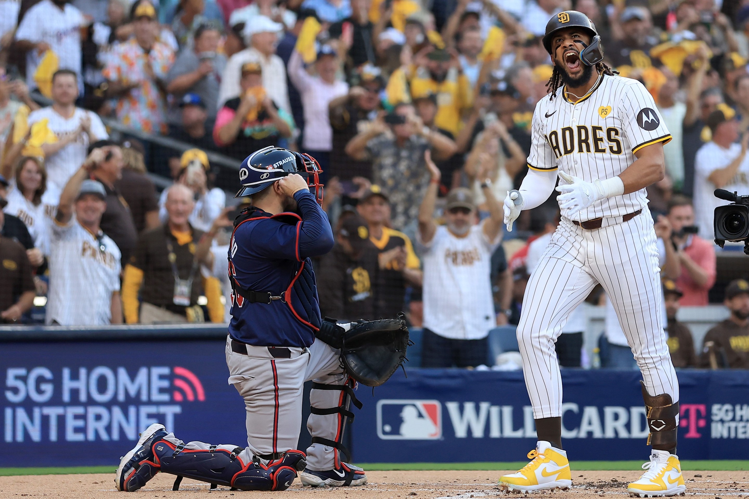 Fernando Tatis Jr. #23 of the San Diego Padres celebrates after hitting a two run home run against AJ Smith-Shawver #32 of the Atlanta Braves.