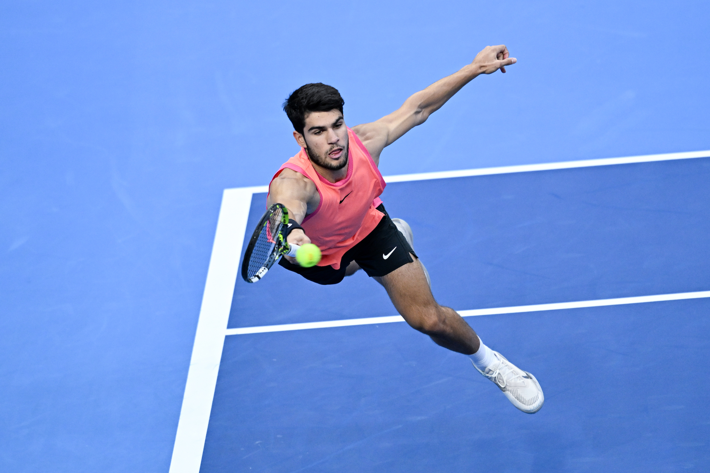 Carlos Alcaraz of Spain returns a shot in the Men's singles final match against Jannik Sinner of Italy on Day 10 of the China Open