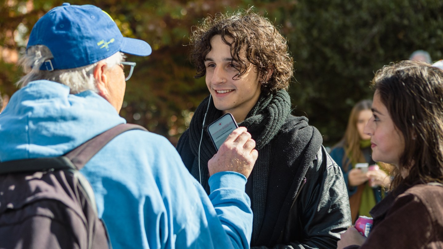 Scott Lynch, one of the other journalists who showed up to the event early, interviews a Timothée.