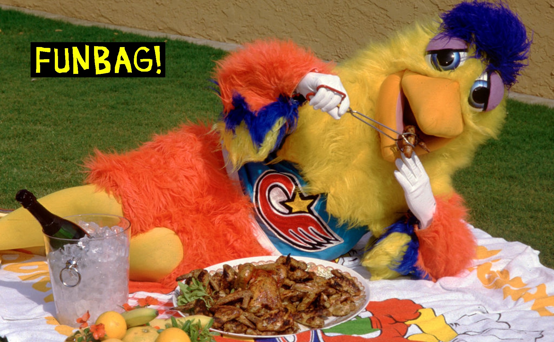 SAN DIEGO, CALIFORNIA - APRIL 15: San Diego Chicken (Ted Giannoulis) cooks up some chicken wings on his grill at his home nest, April 15, 1986 in San Diego, California.