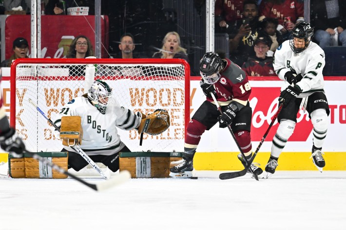 LAVAL, CANADA - MAY 09: Goaltender Aerin Frankel #31 of Boston stretches out the pads as teammate Lexie Adzija #8 defends against Mikyla Grant-Mentis #18 of Montreal during the second period in the PWHL game at Place Bell on May 9, 2024 in Laval, Quebec, Canada.