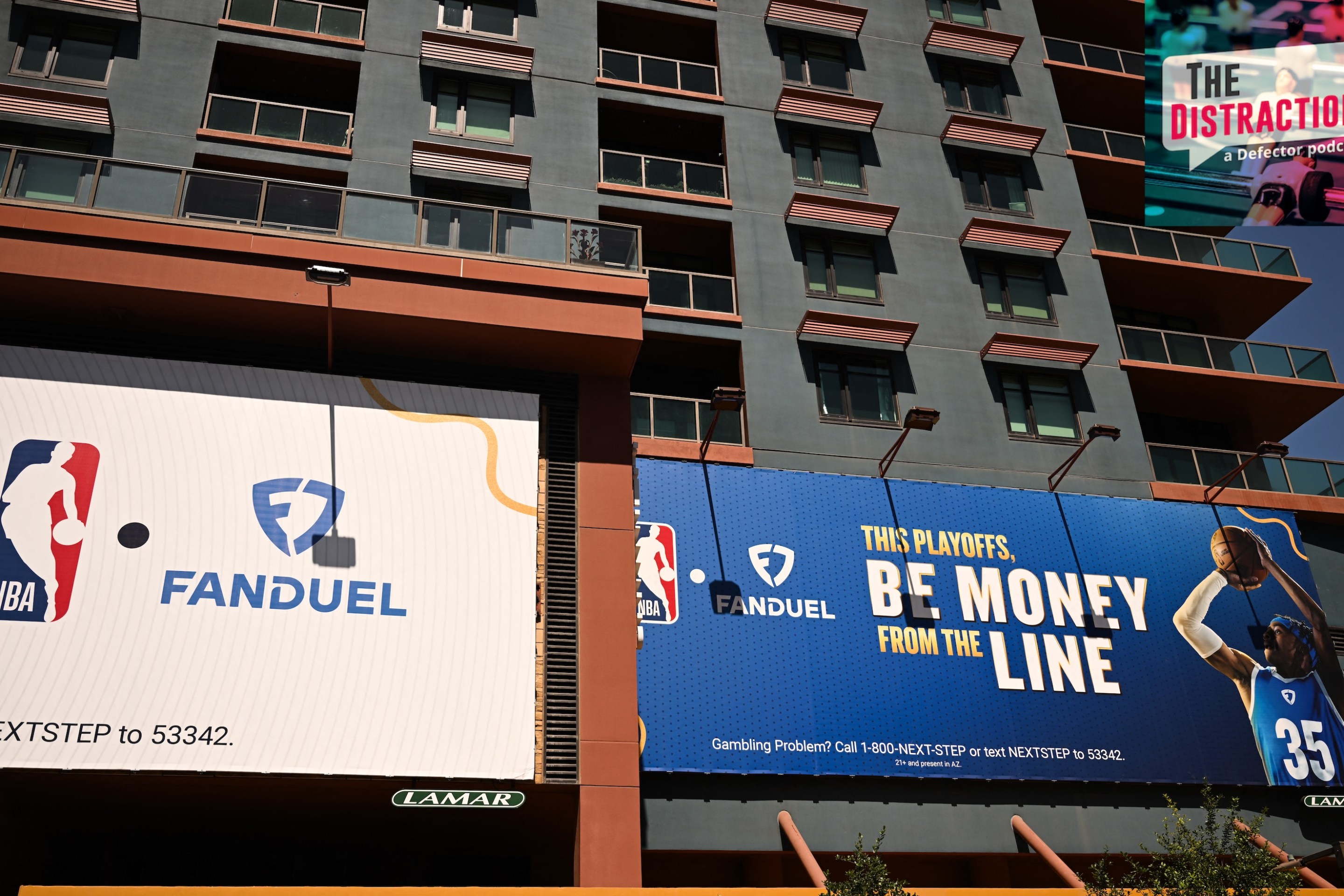 NBA and FanDuel online sports betting signage is displayed on the side of a building in Phoenix, Arizona.