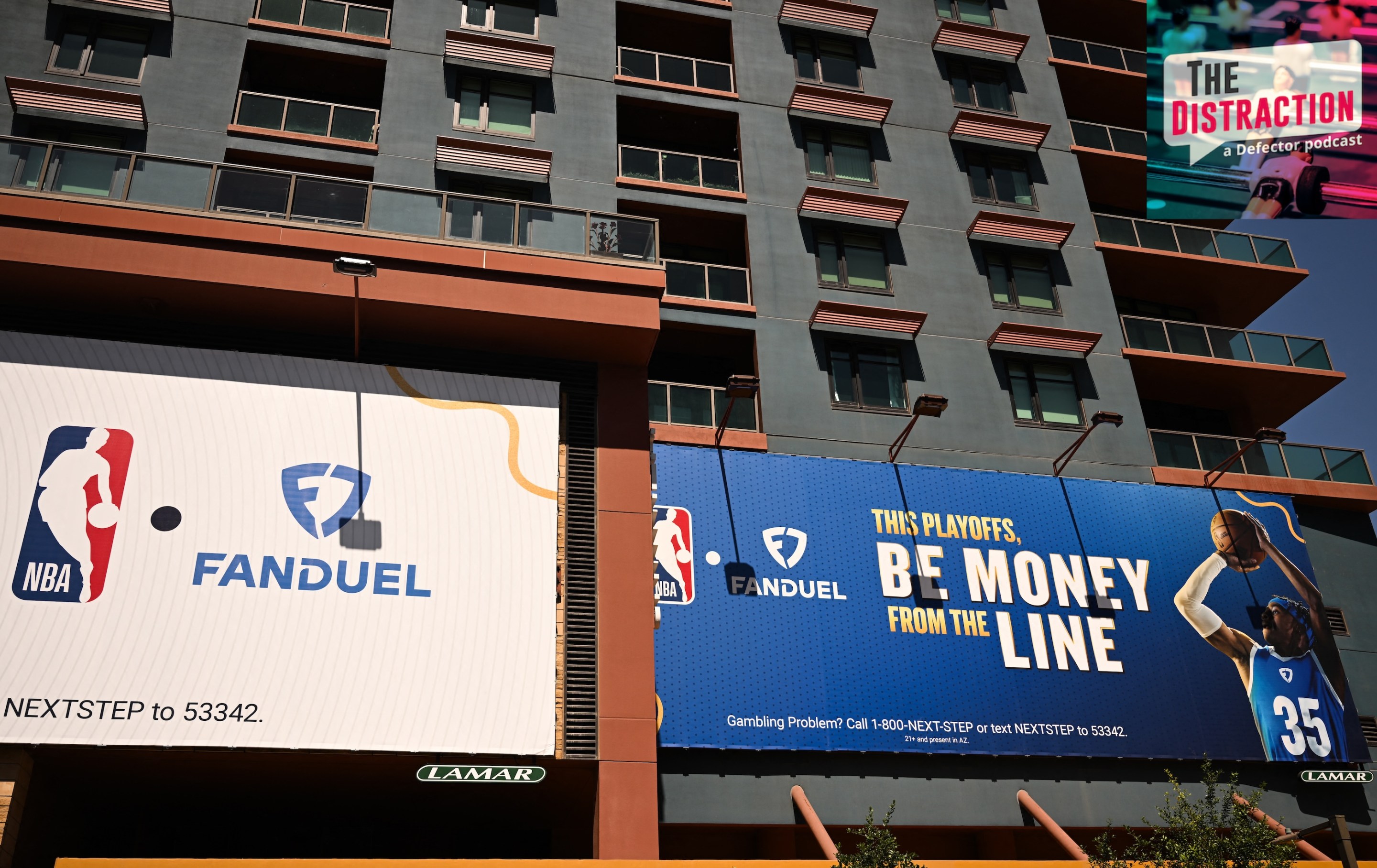 NBA and FanDuel online sports betting signage is displayed on the side of a building in Phoenix, Arizona.