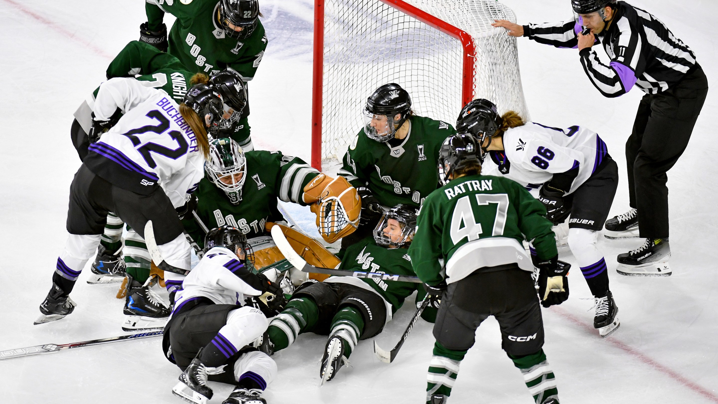 Referee David Elford blows the whistle as he loses sight of the puck somewhere under Kaleigh Fratkin #13, Hannah Brandt #20, Aerin Frankel #31 of Boston in the crease during scrum in the second period at Tsongas Center on May 29, 2024 in Lowell, Massachusetts.