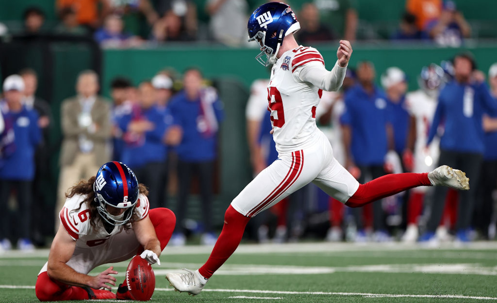 EAST RUTHERFORD, NEW JERSEY - AUGUST 24: Jude McAtamney #99 of the New York Giants kicks against the New York Jets during a preseason game at MetLife Stadium on August 24, 2024 in East Rutherford, New Jersey.